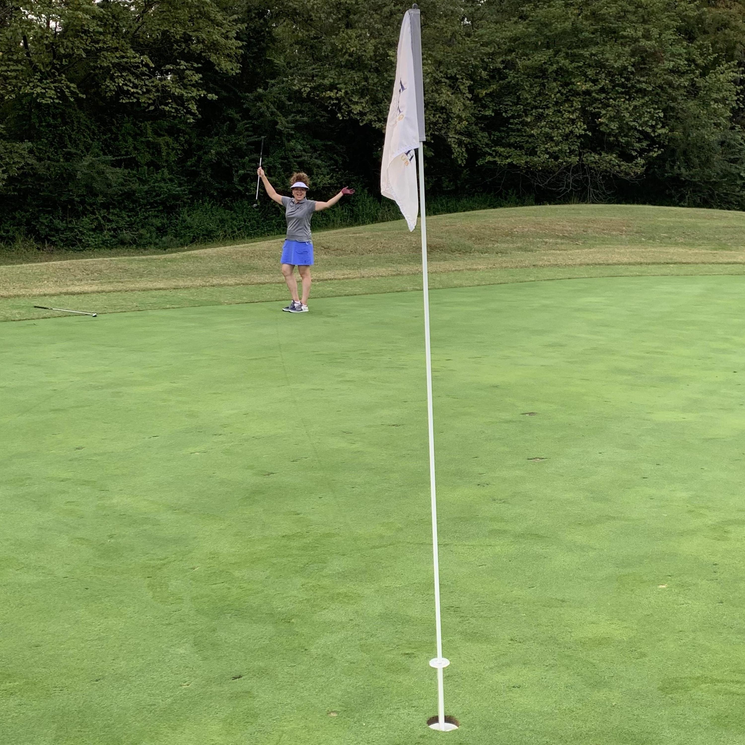 Look at the ball line still on the green. What a putt! (About a 35 footer)