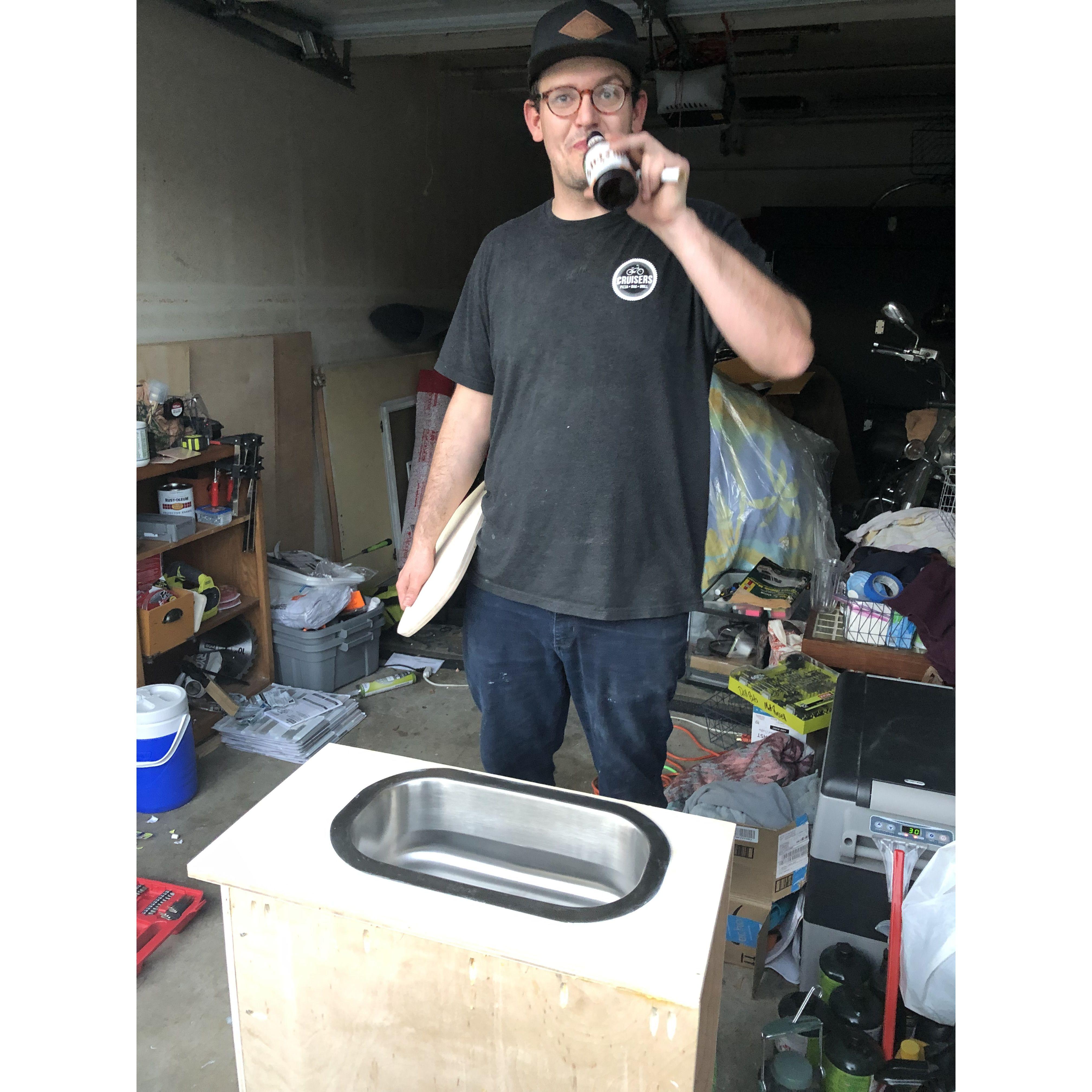 Building our sink, having a beer.
