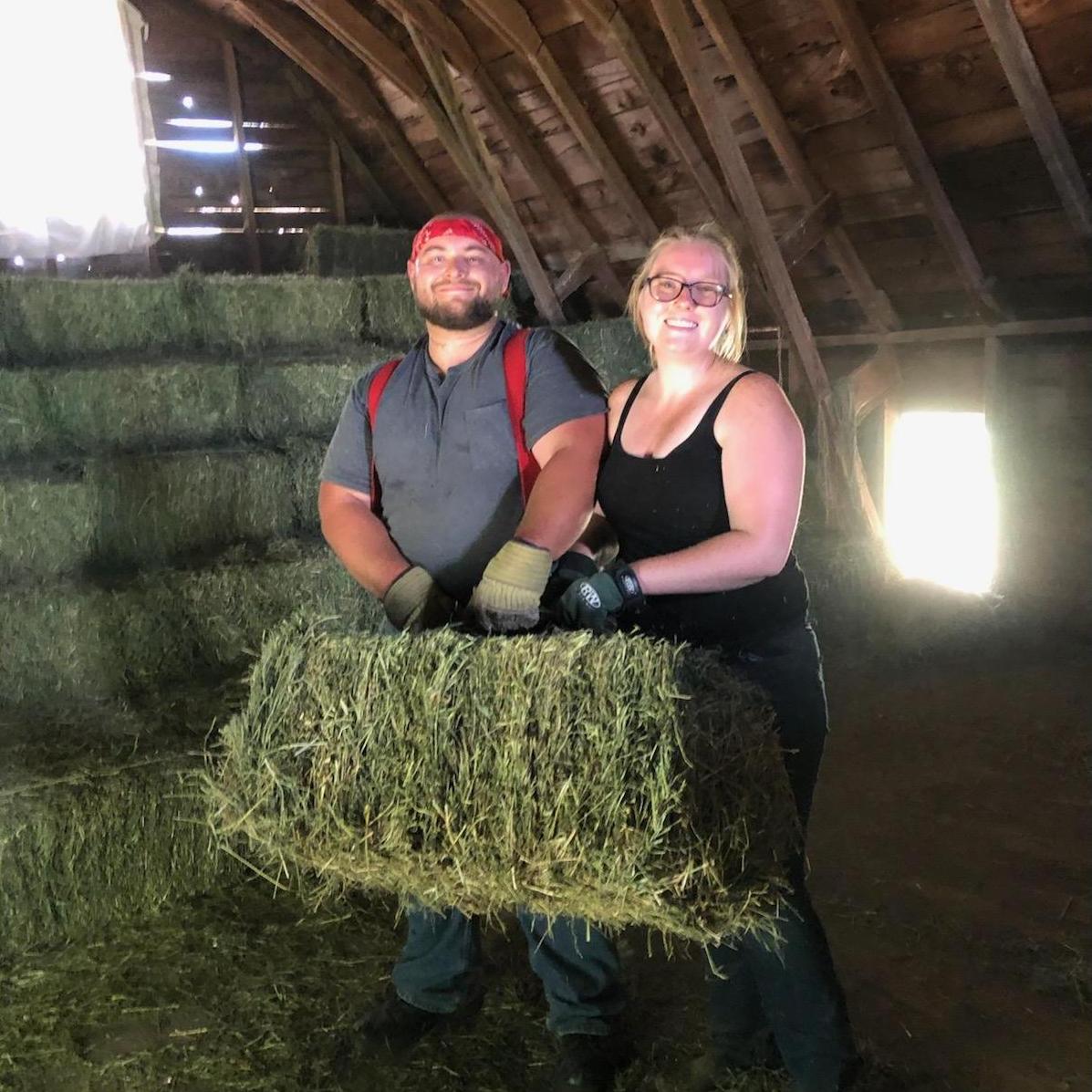 Toni and Marty moving hay bales!