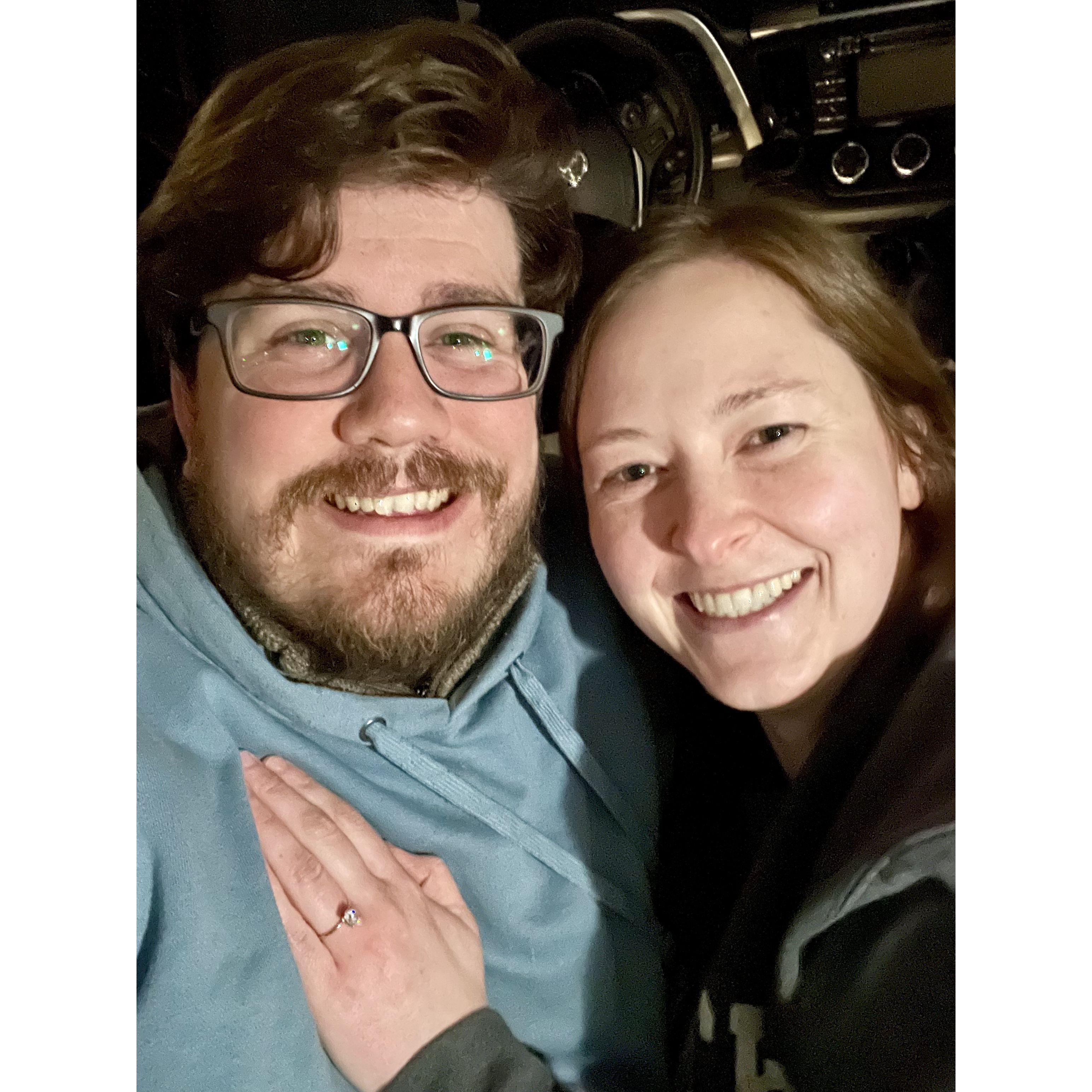 In the car after Josiah proposed while stargazing on a clear spring night.