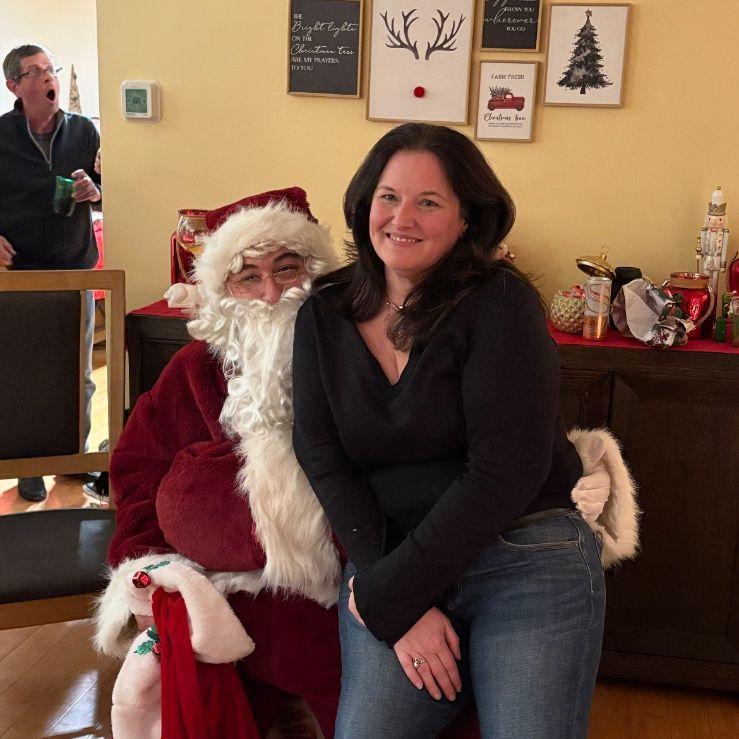 Amy sitting on  Santa's lap