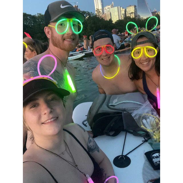 Enjoying 4th of July Fireworks while paddle-boarding at lady bird lake with friends.