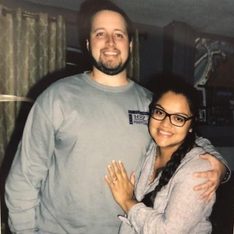 A photograph of a Polaroid declaring our engagement and shouting our height difference. (credit to Clyde Servellon) 2018.
