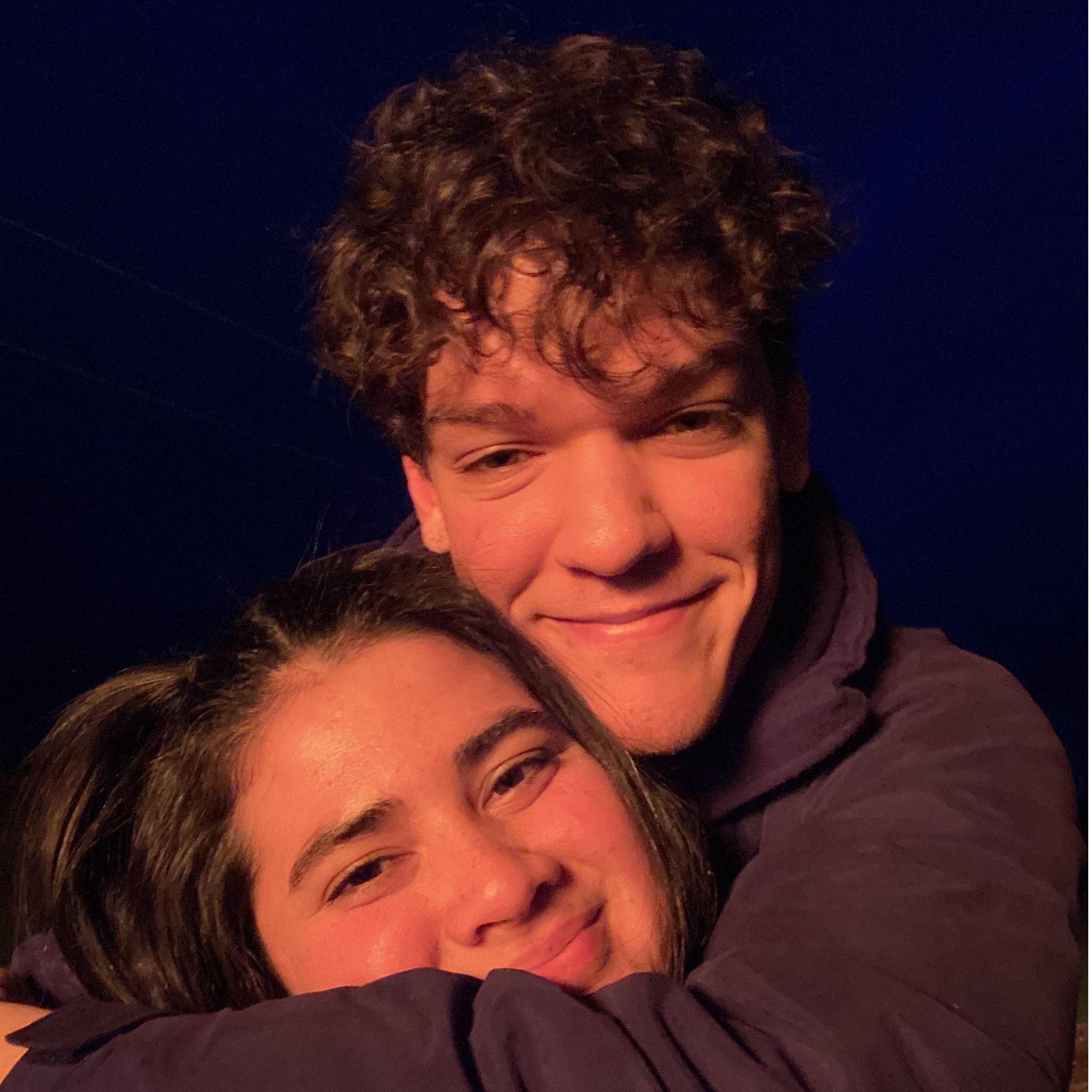 Cute photos together lit up by the giant bonfire.