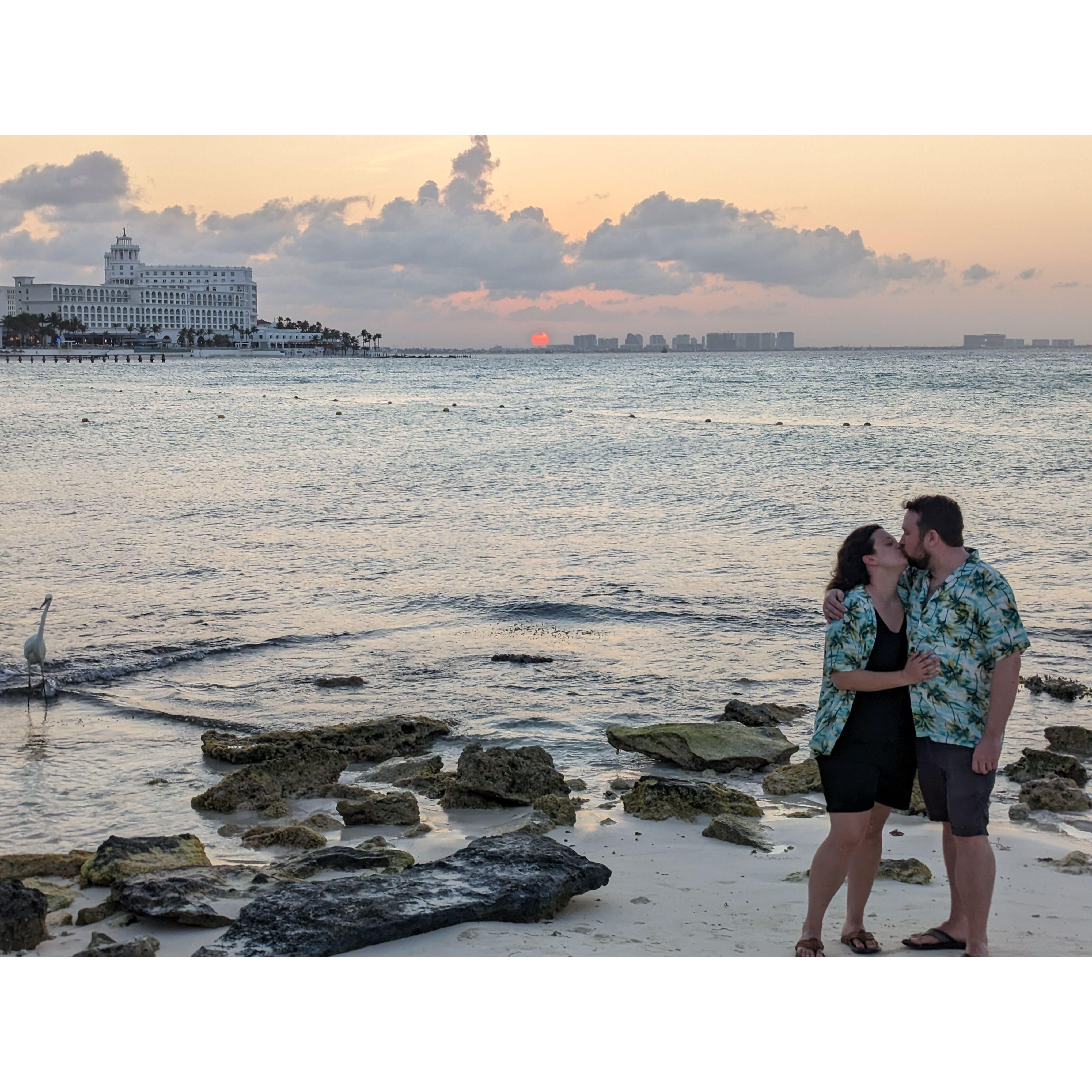 This was taken in Cancun, Mexico. We had both only ever been on east coast beaches, so a sunset over the ocean (even if only partial) was exciting!