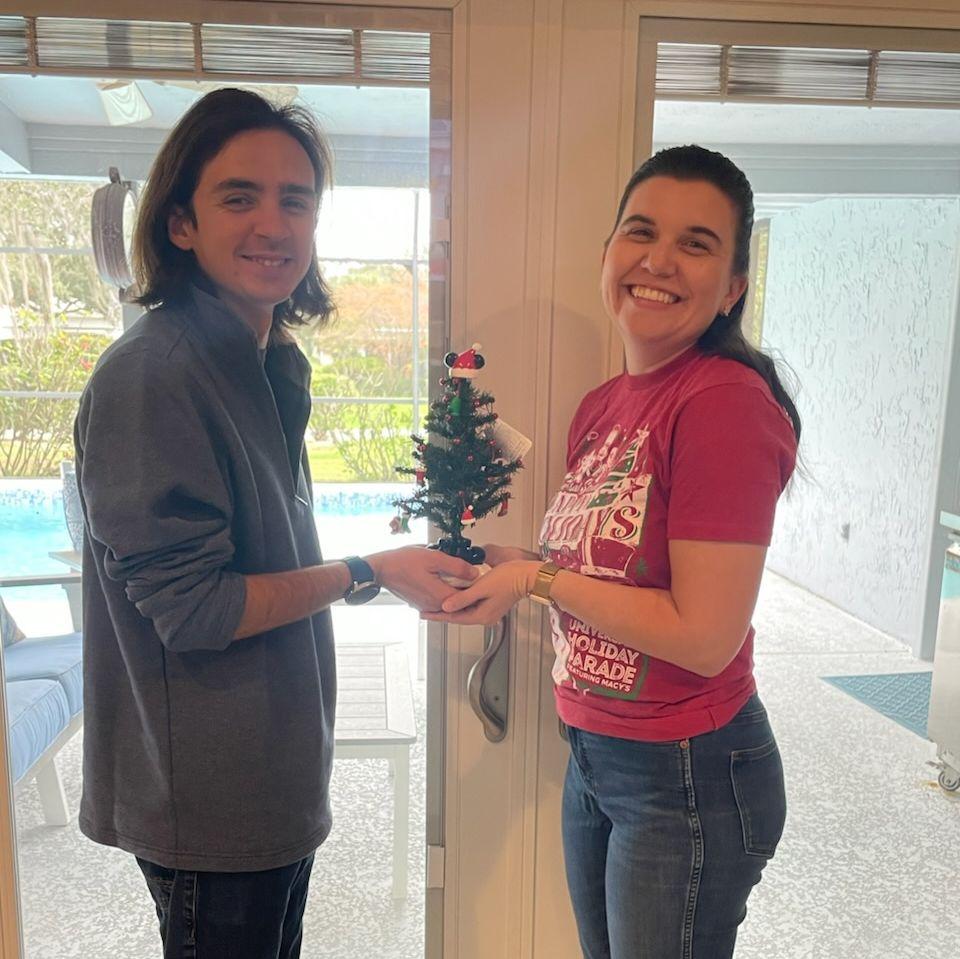 Celebrating our first Christmas together, right before Alex had to go work Universal's Holiday Parade.