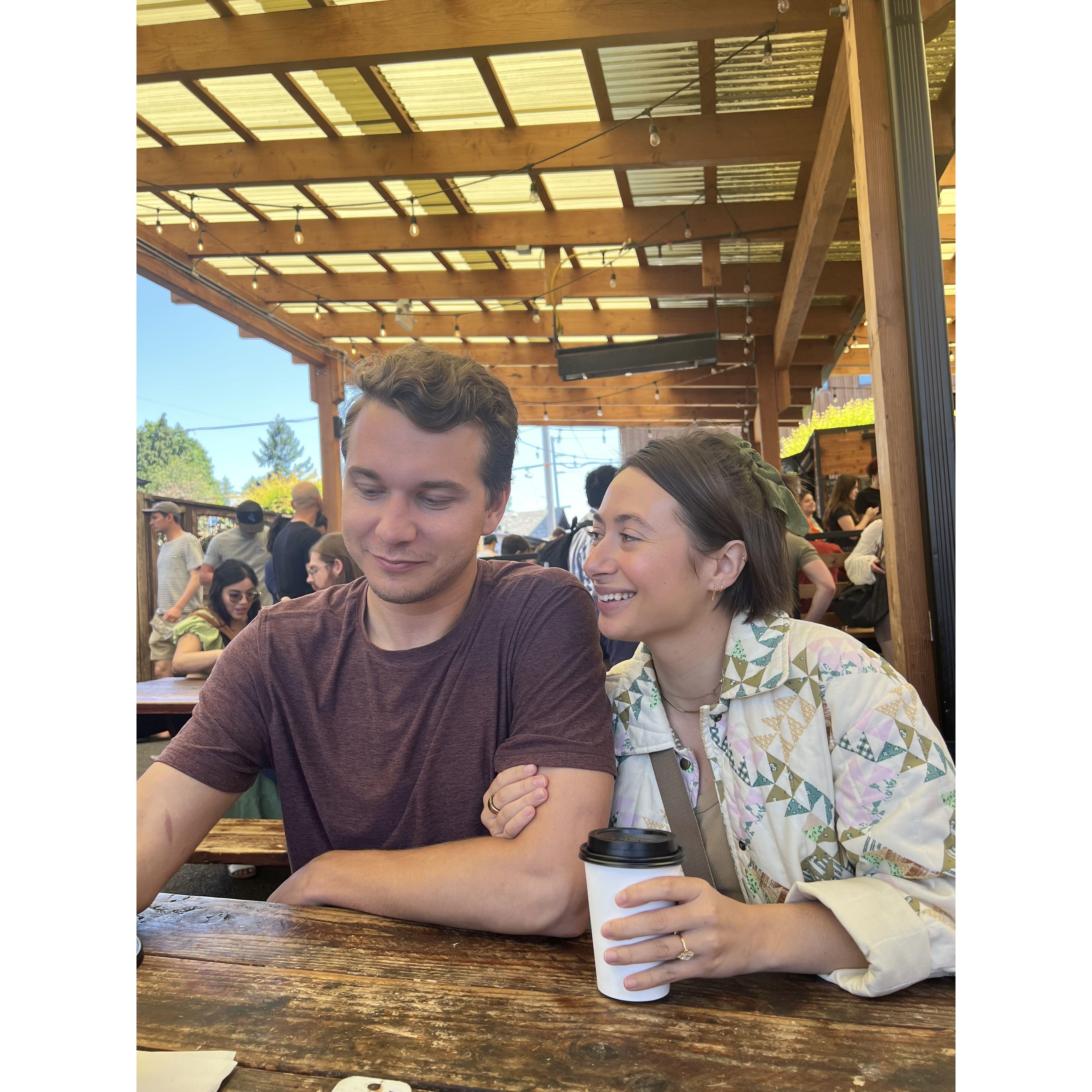 Victoria & Leo sharing coffee in Portland in the company of their friends.