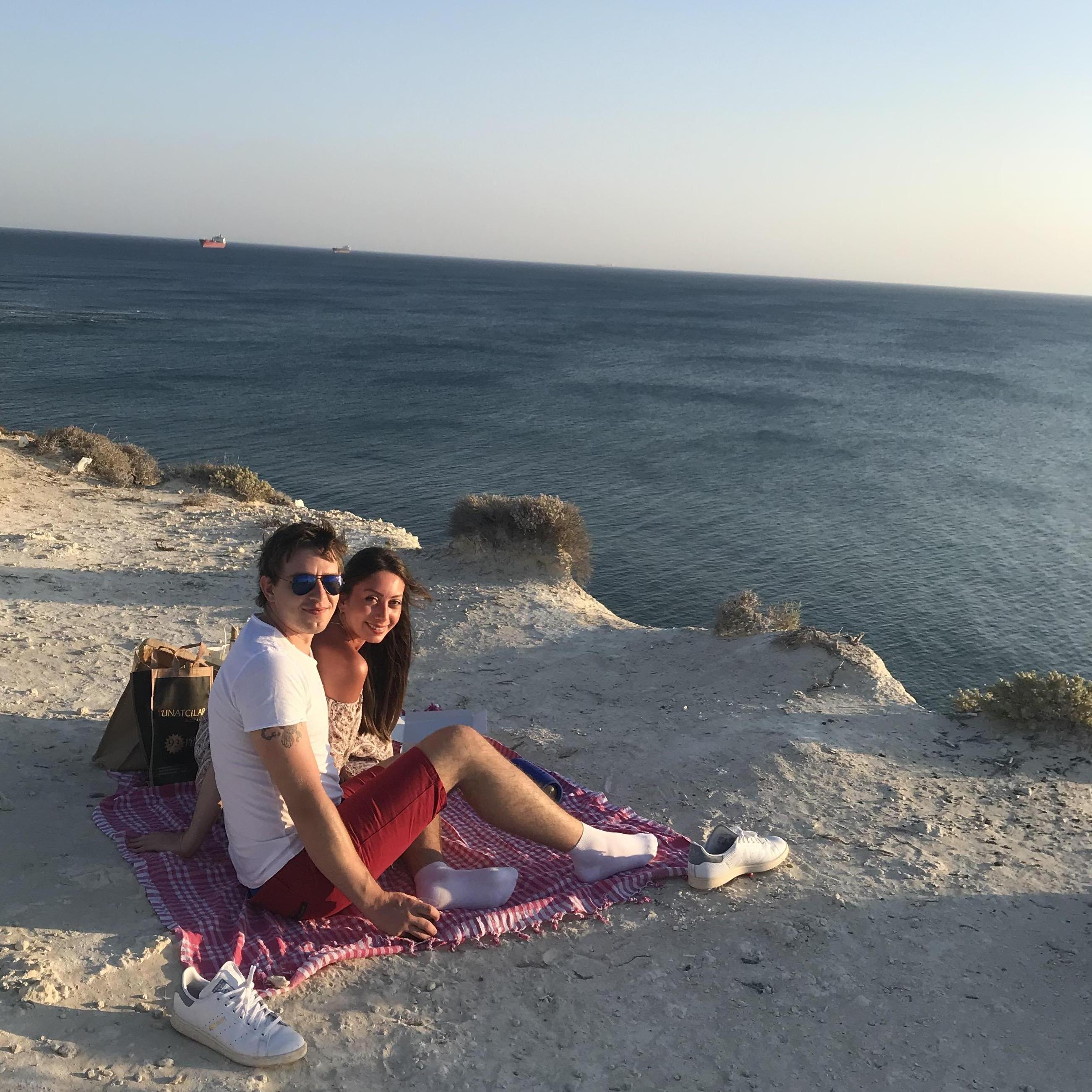 Watching lovely sunset from the edge of an island together