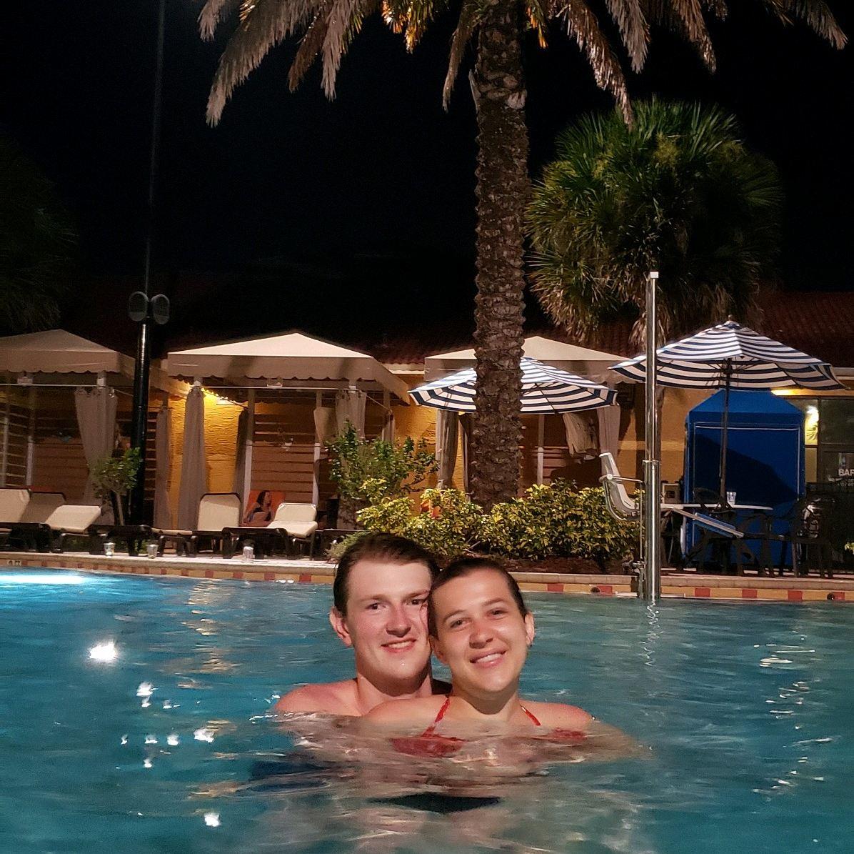 Cuddles in the Florida pool under the palm tree