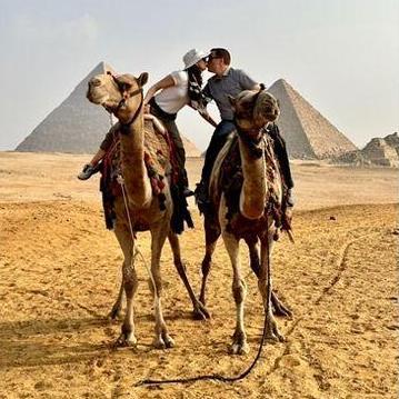 Riding camels at the Great Pyramid of Giza in December 2023