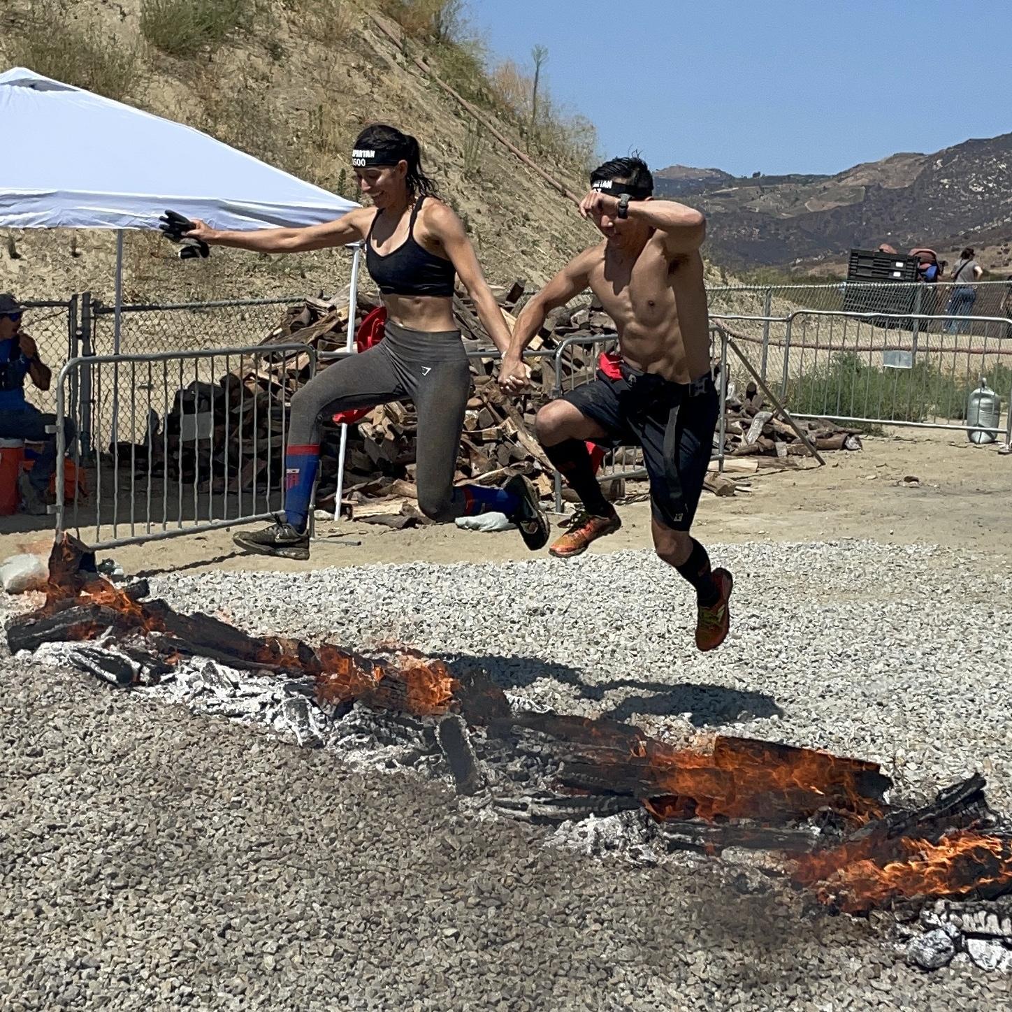 Leaping over the flames of adversity at our first Spartan together at the Temecula