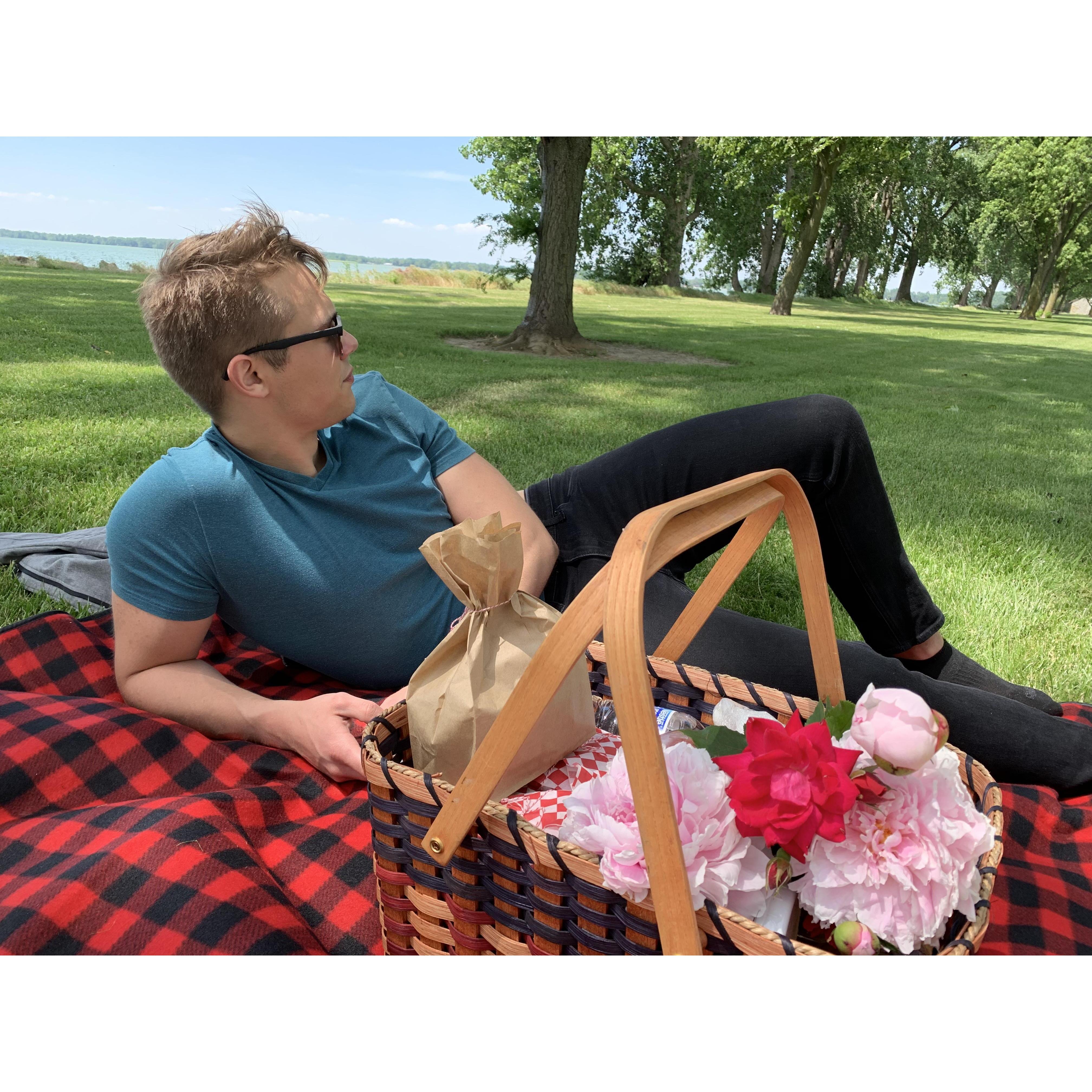 Moments before the proposal.  Enjoying a picnic by the lake.
