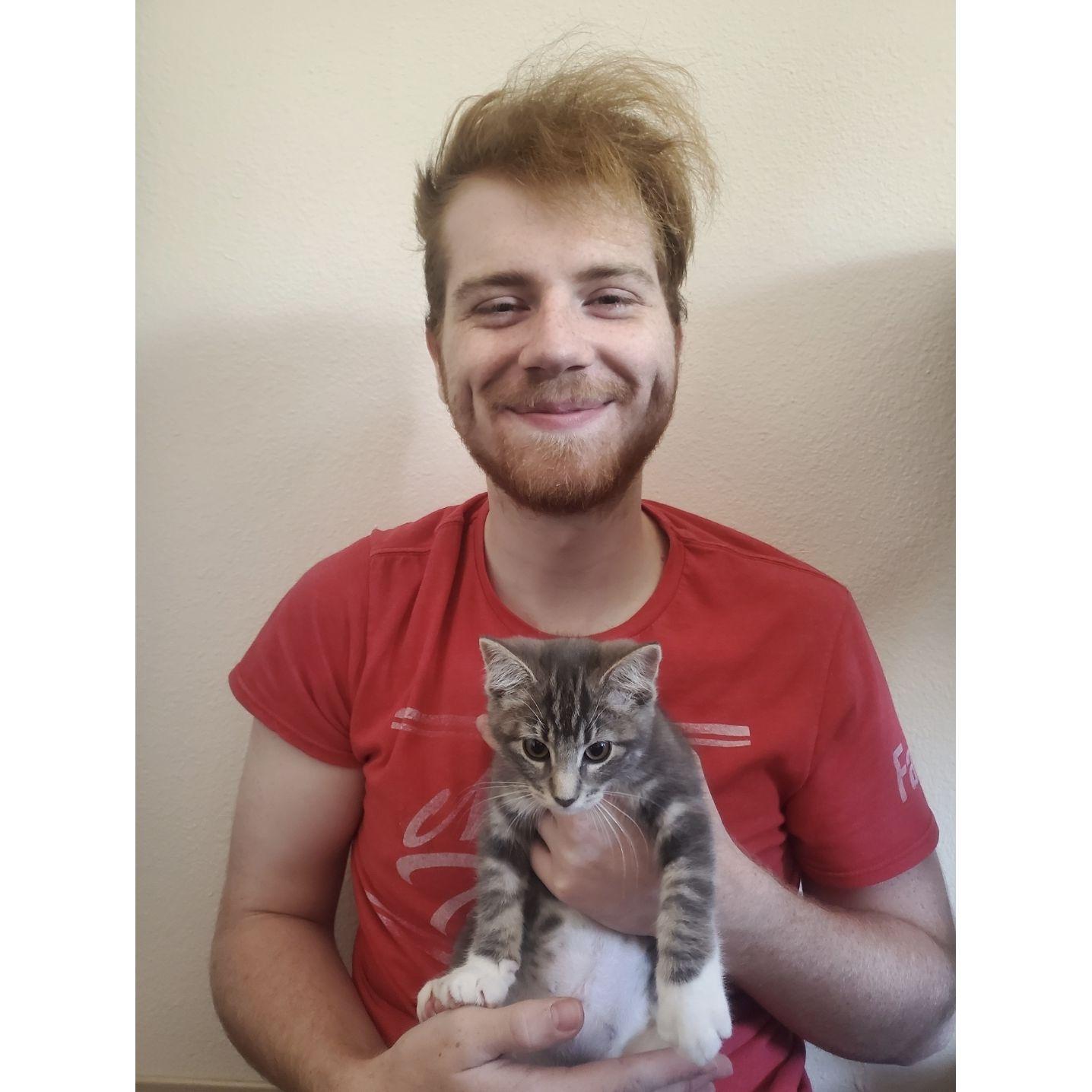 In 2022 Ethan's love of cats prompted the two to adopt another sweet- and sometimes sour- kitten named Lilith. Now they are a happy family of four!