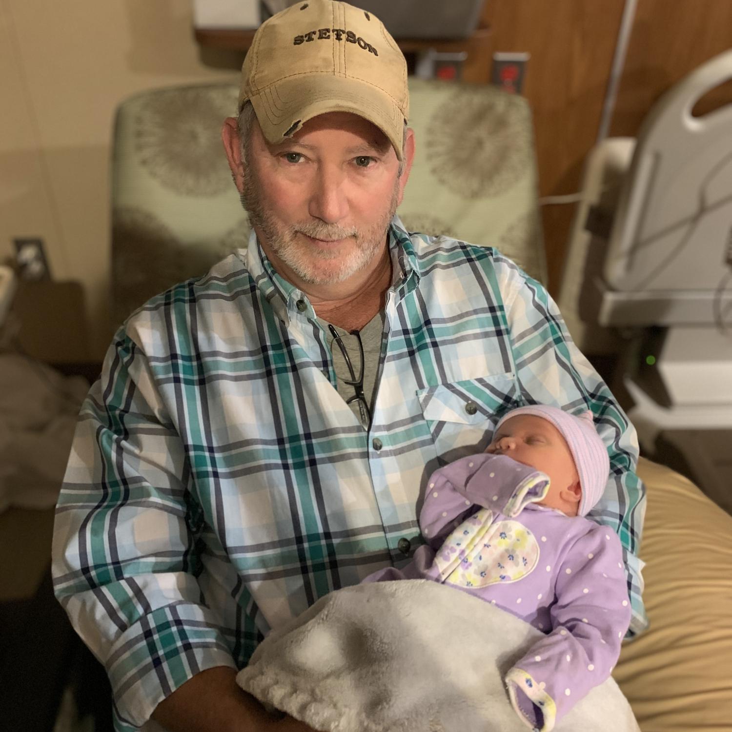 Dad holding his first granddaughter!