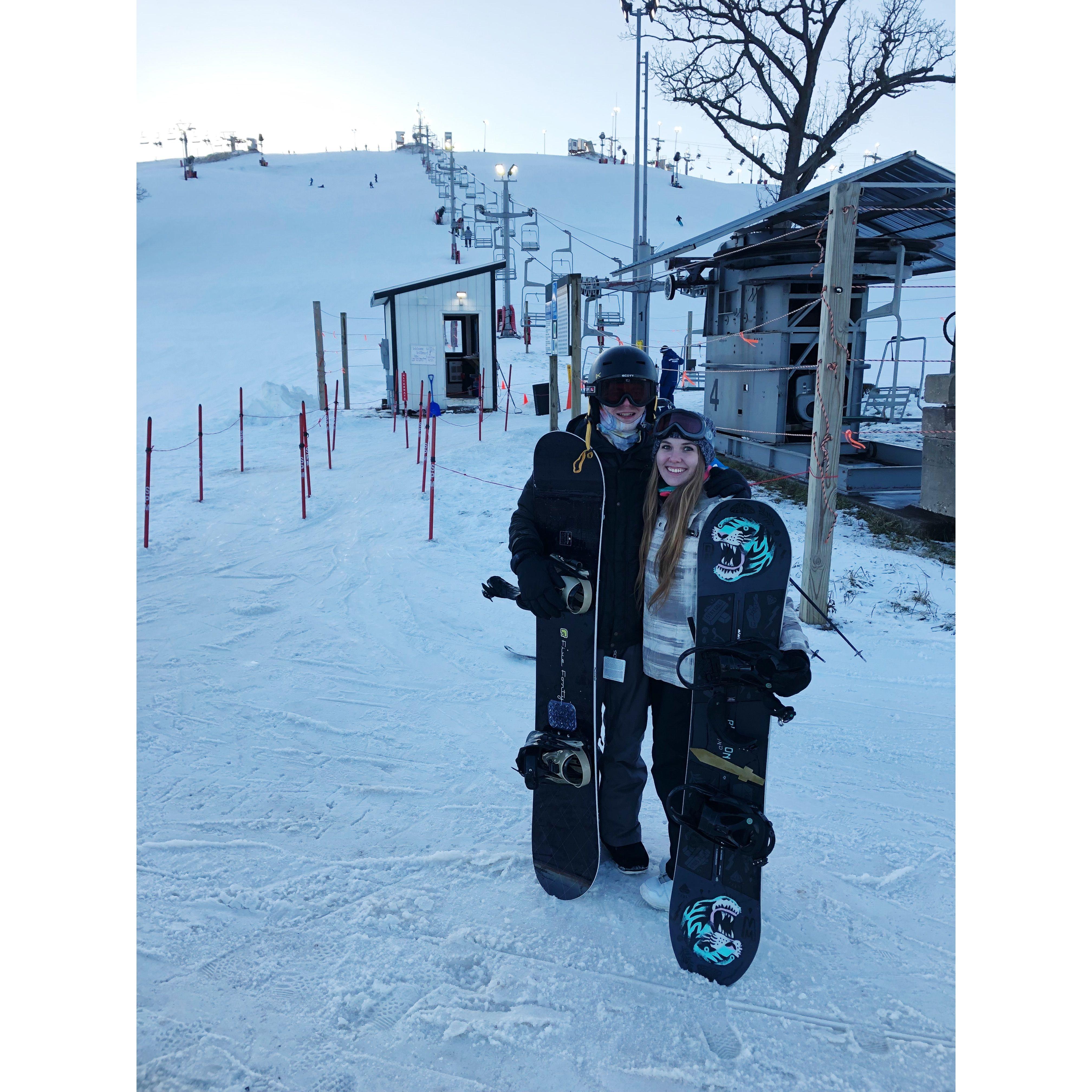 Teaching Eric how to snowboard