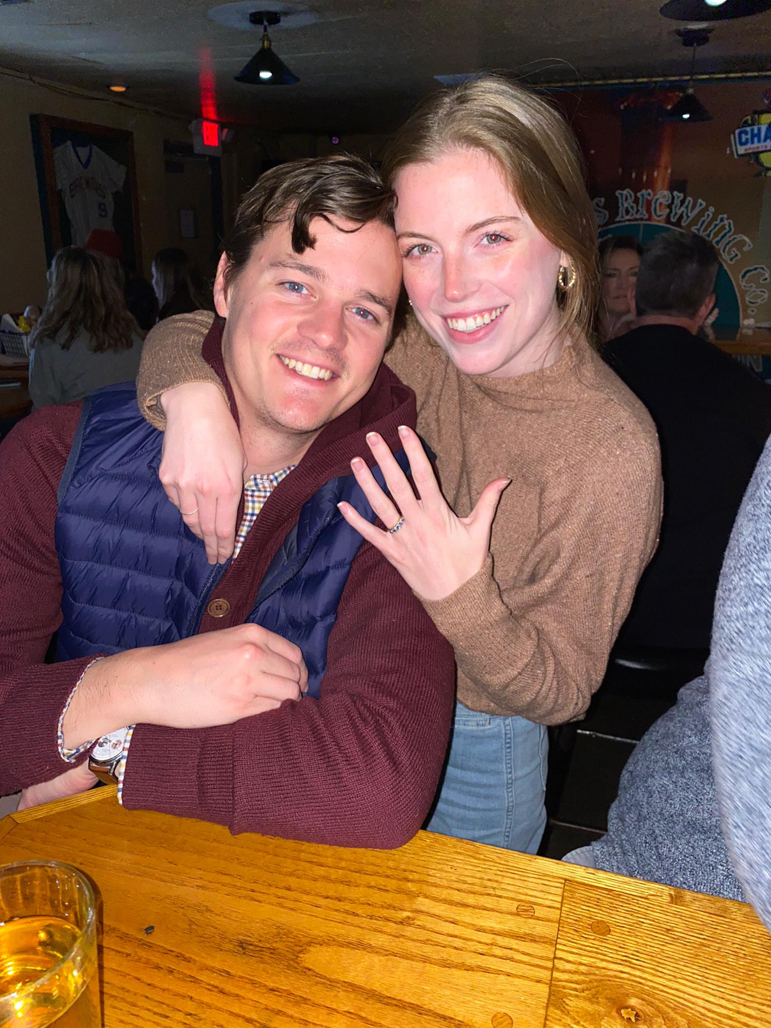 Celebrating our engagement with friends at our favorite spot in Lake Geneva, Champs!