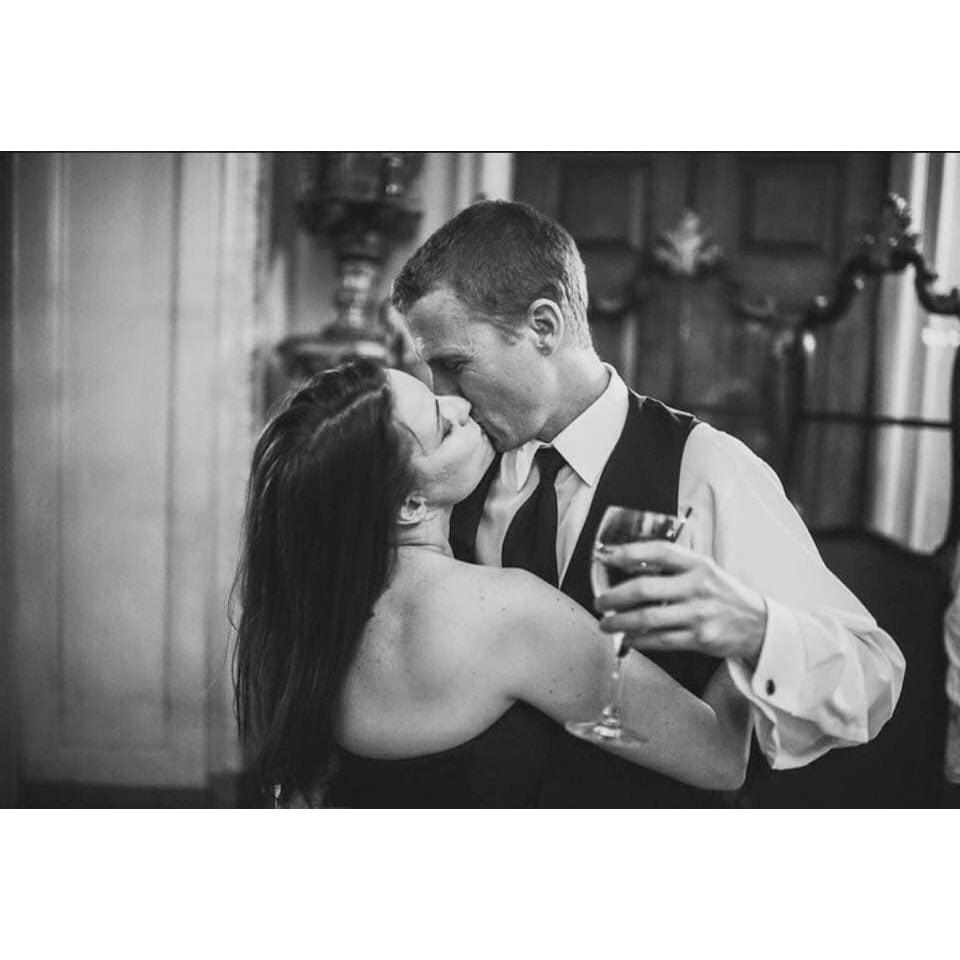 Great candid photo captured at our friends' wedding not long after we started dating (this time).
