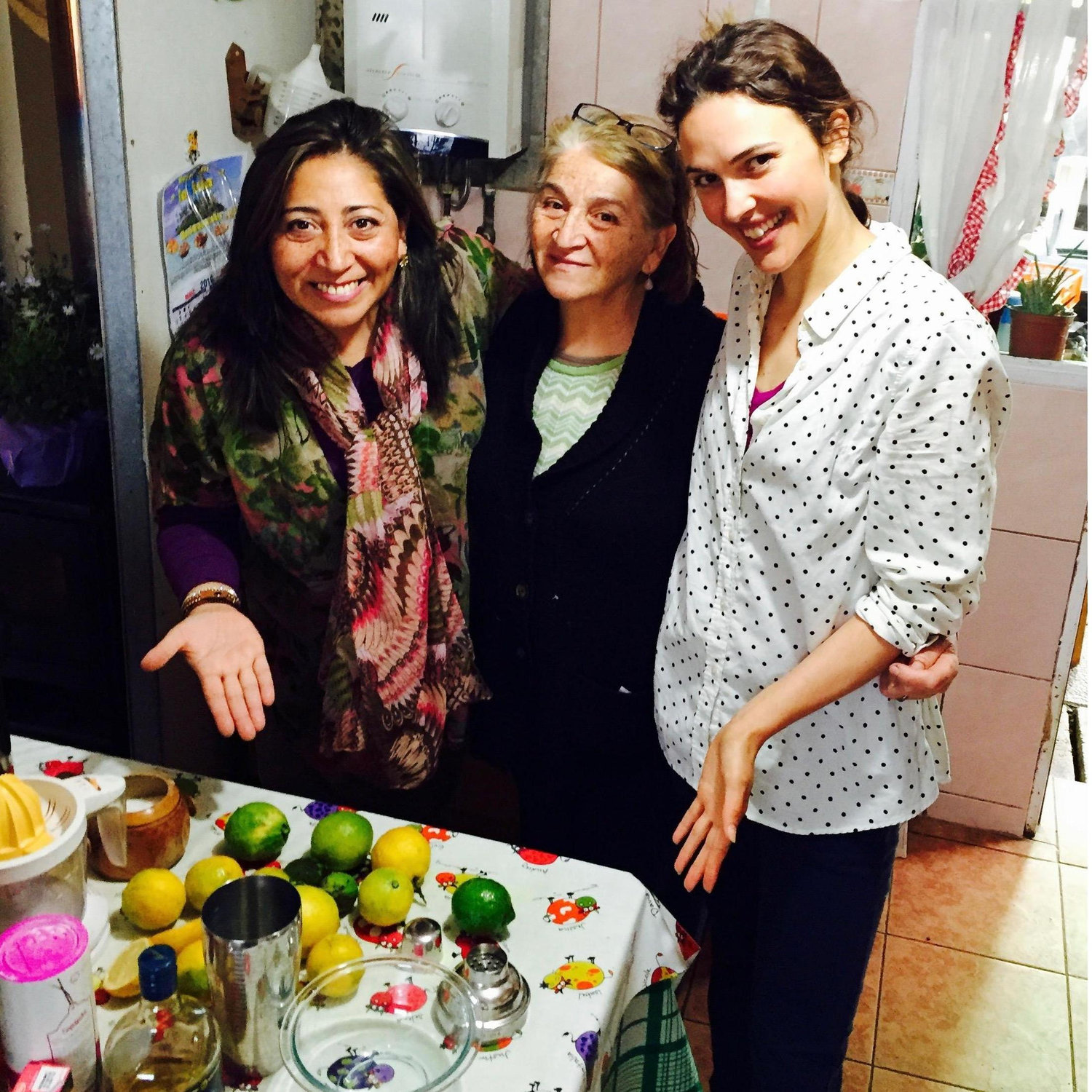 Oriel's sister, Lorena, and mom, Gloria, teaching Abby how to make Pisco Sours.