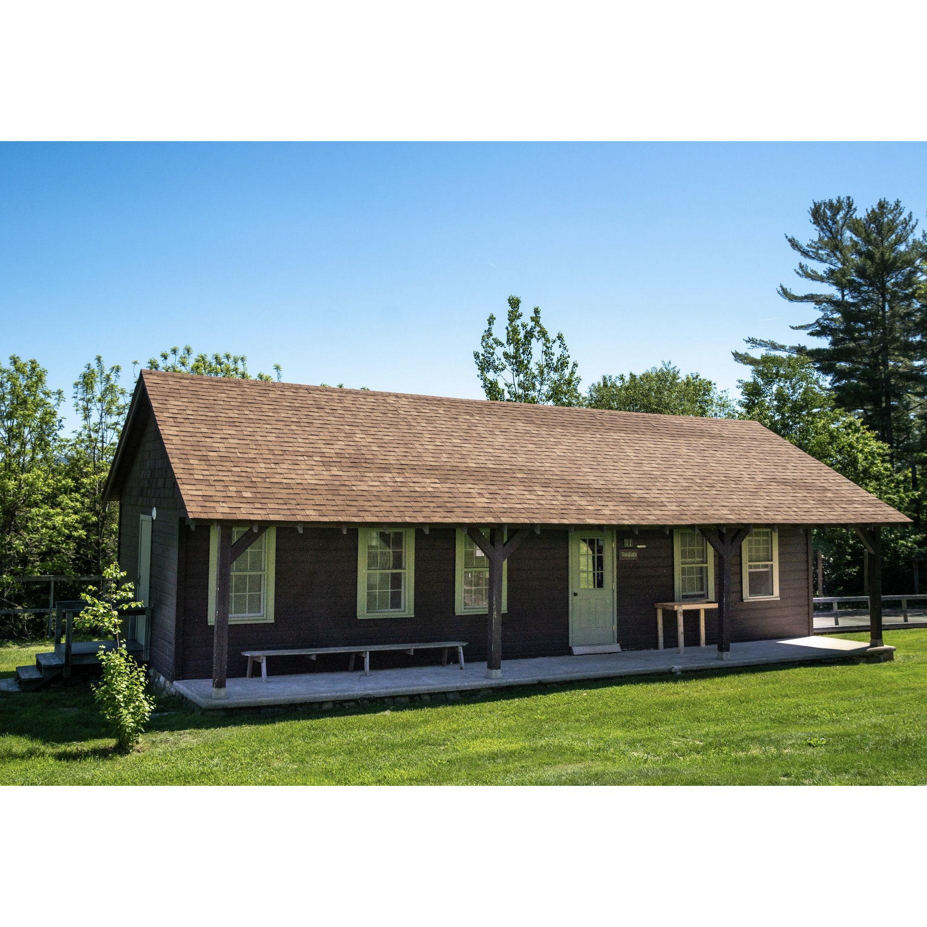 Most cabins are a little bit different on the outside. Several have porches like this one, though all of them share these features: full bathrooms, space heaters, and linens.