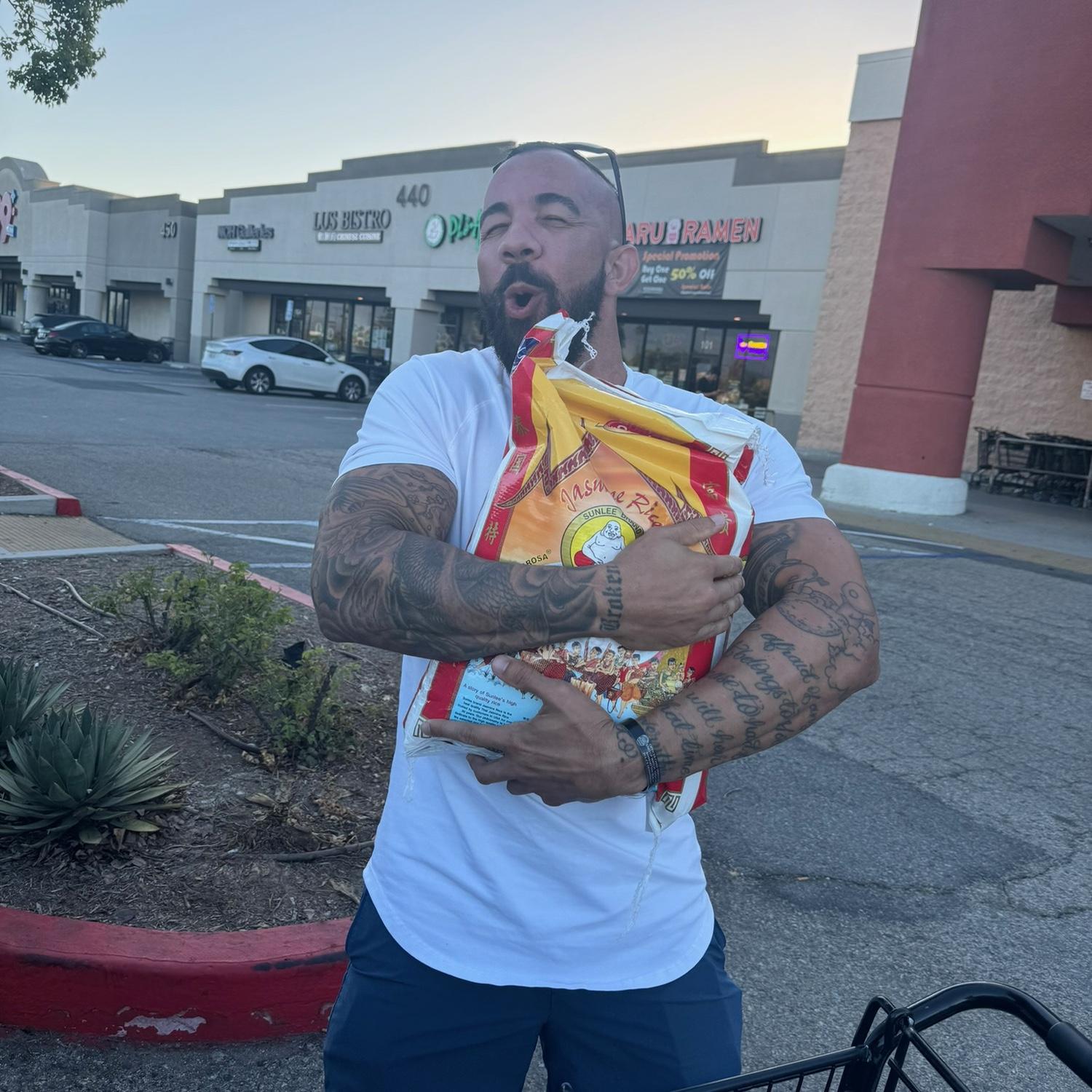 Milestone moment: his first 50 lb bag of rice 🍚