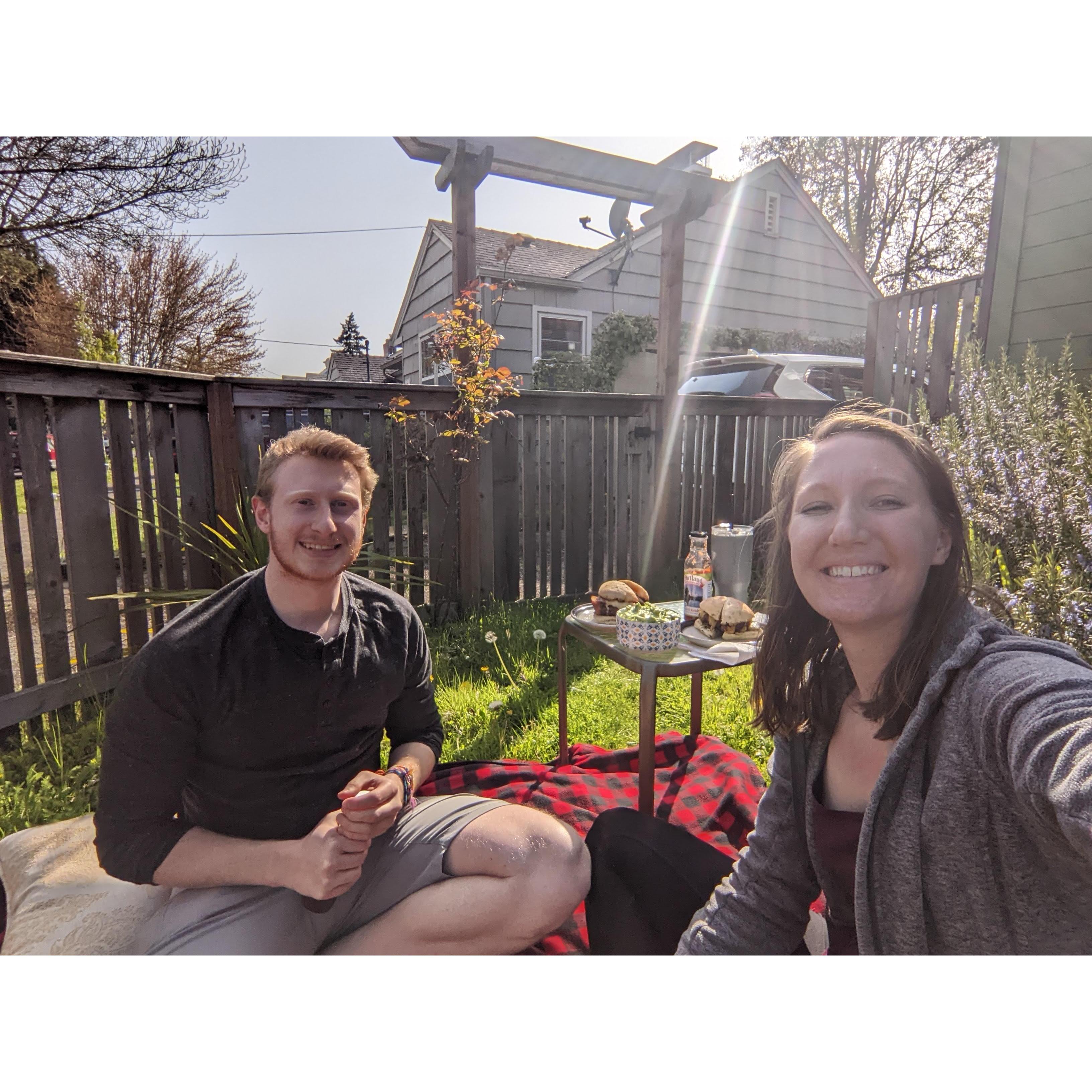 Enjoying the sunshine with picnics in the front yard.