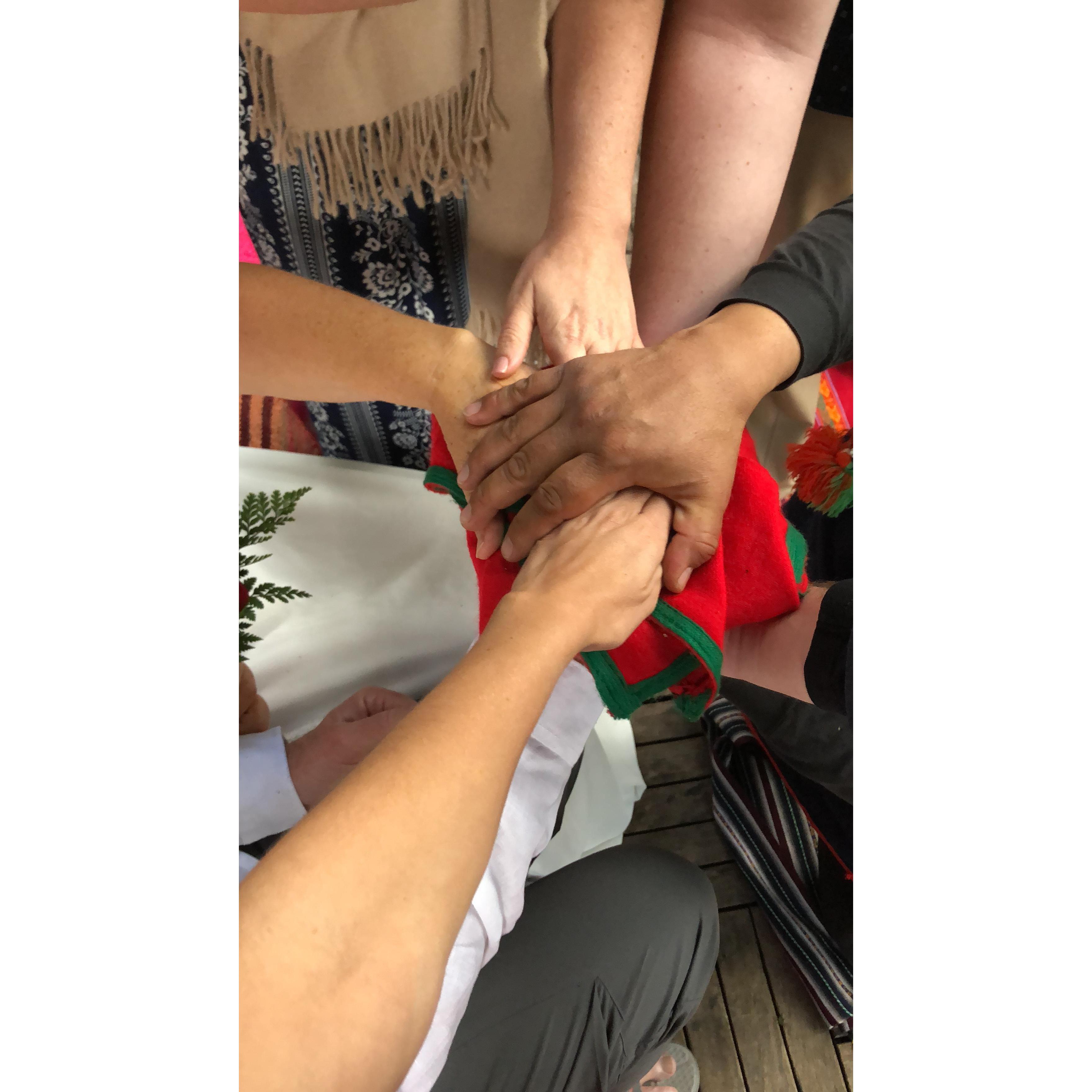 All of us in Peru putting our hands in for a Peruvian prayer for Donna and Terry.