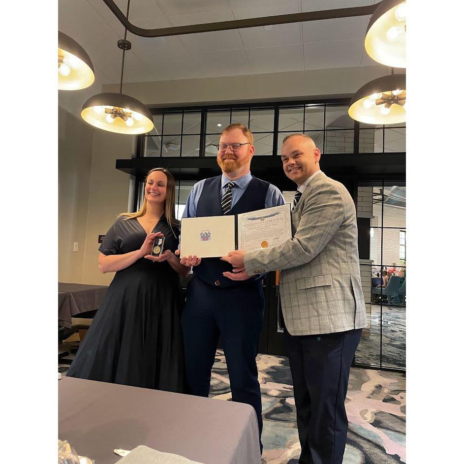 Count Cramton receiving the Royal Family Service Award