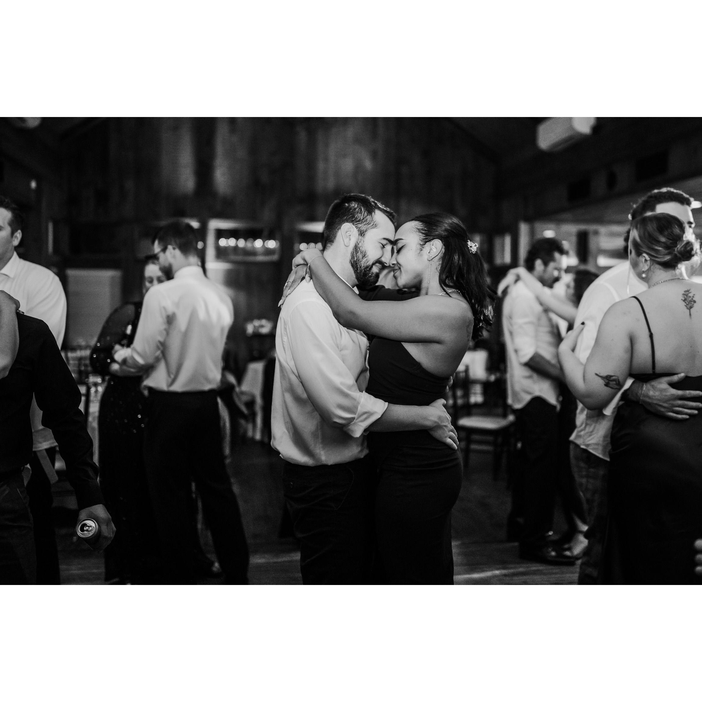 Someone captured this picture during a slow dance at a wedding reception