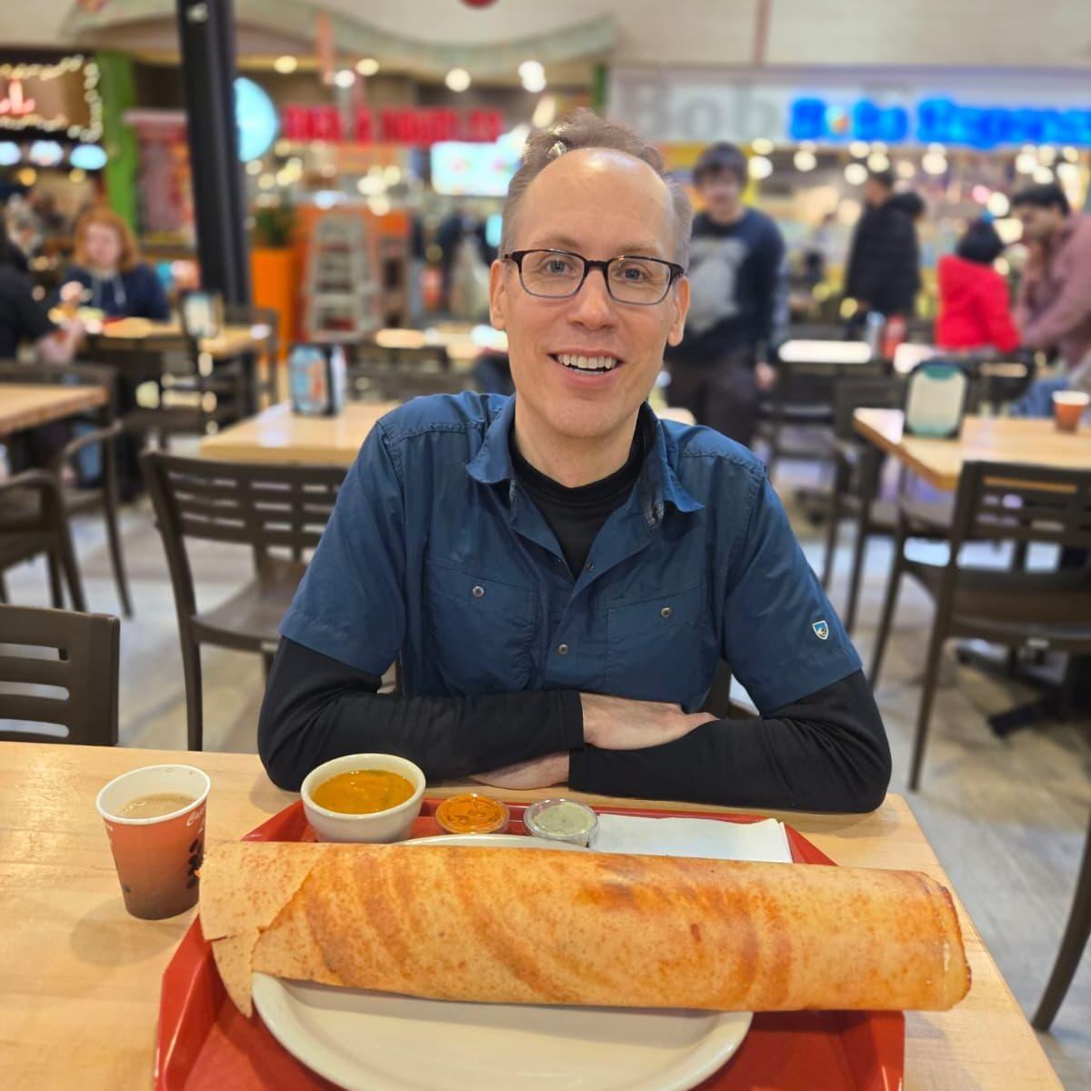 Troy's first time eating a dosa. He devoured it!
