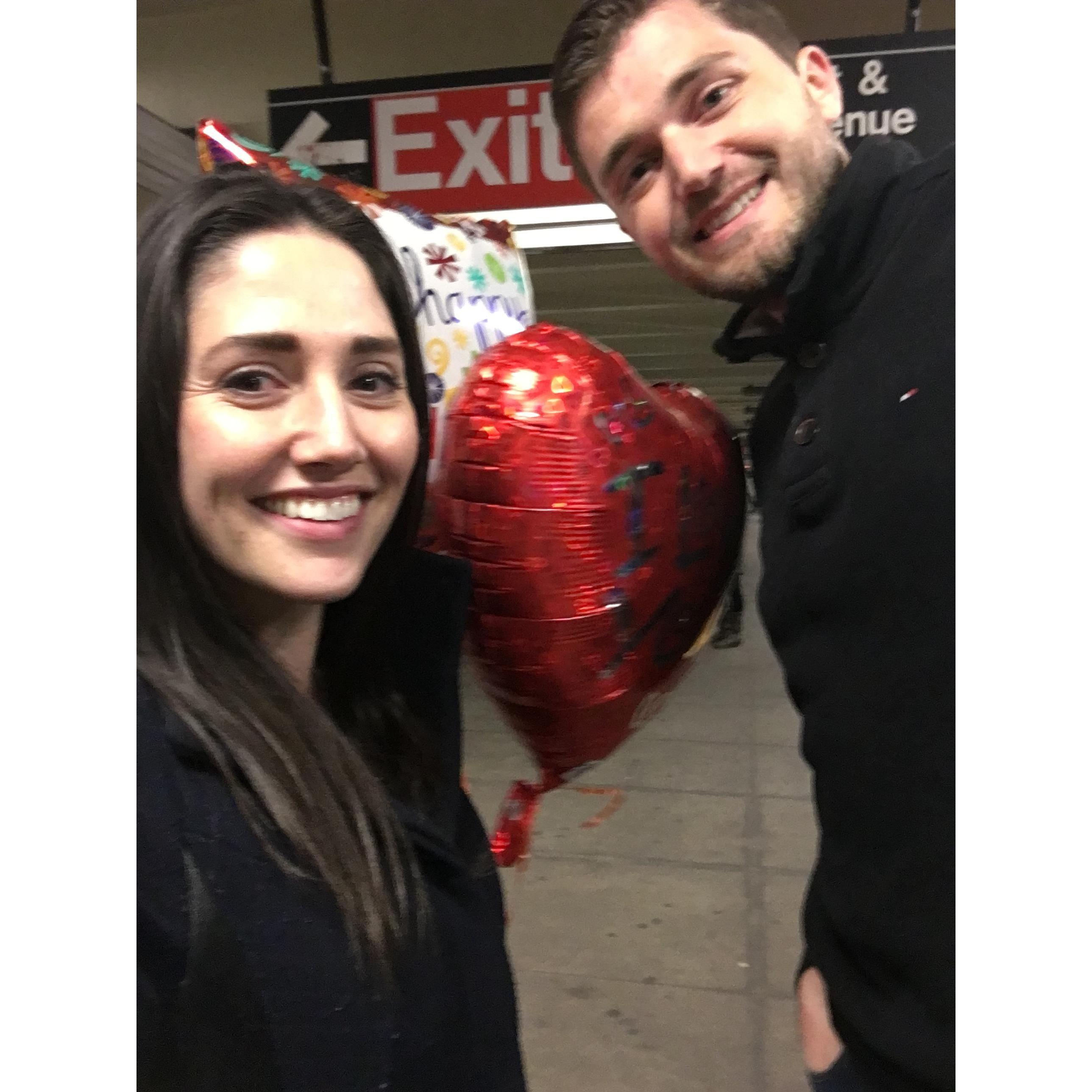 Birthday balloons on the subway