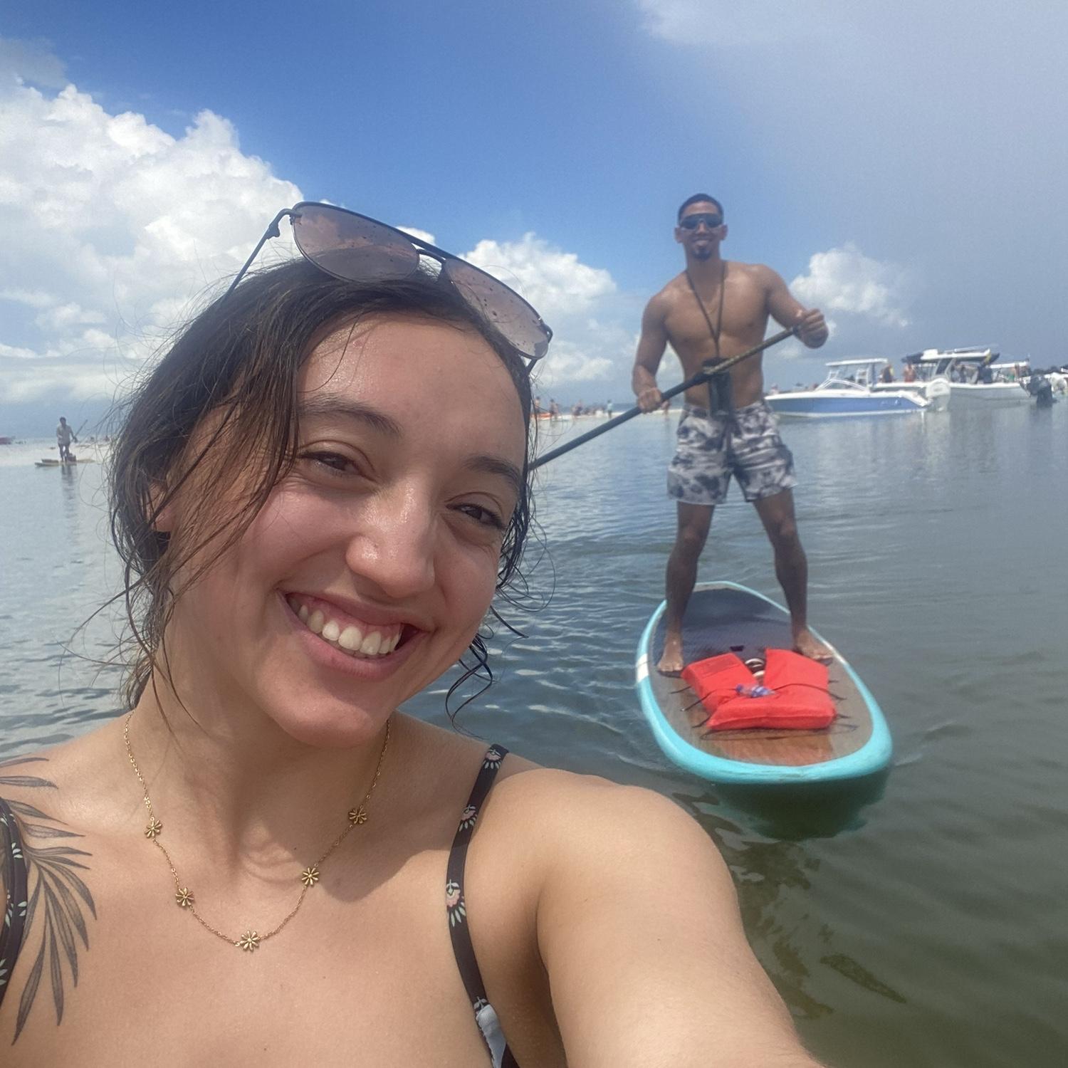 His first time paddle boarding