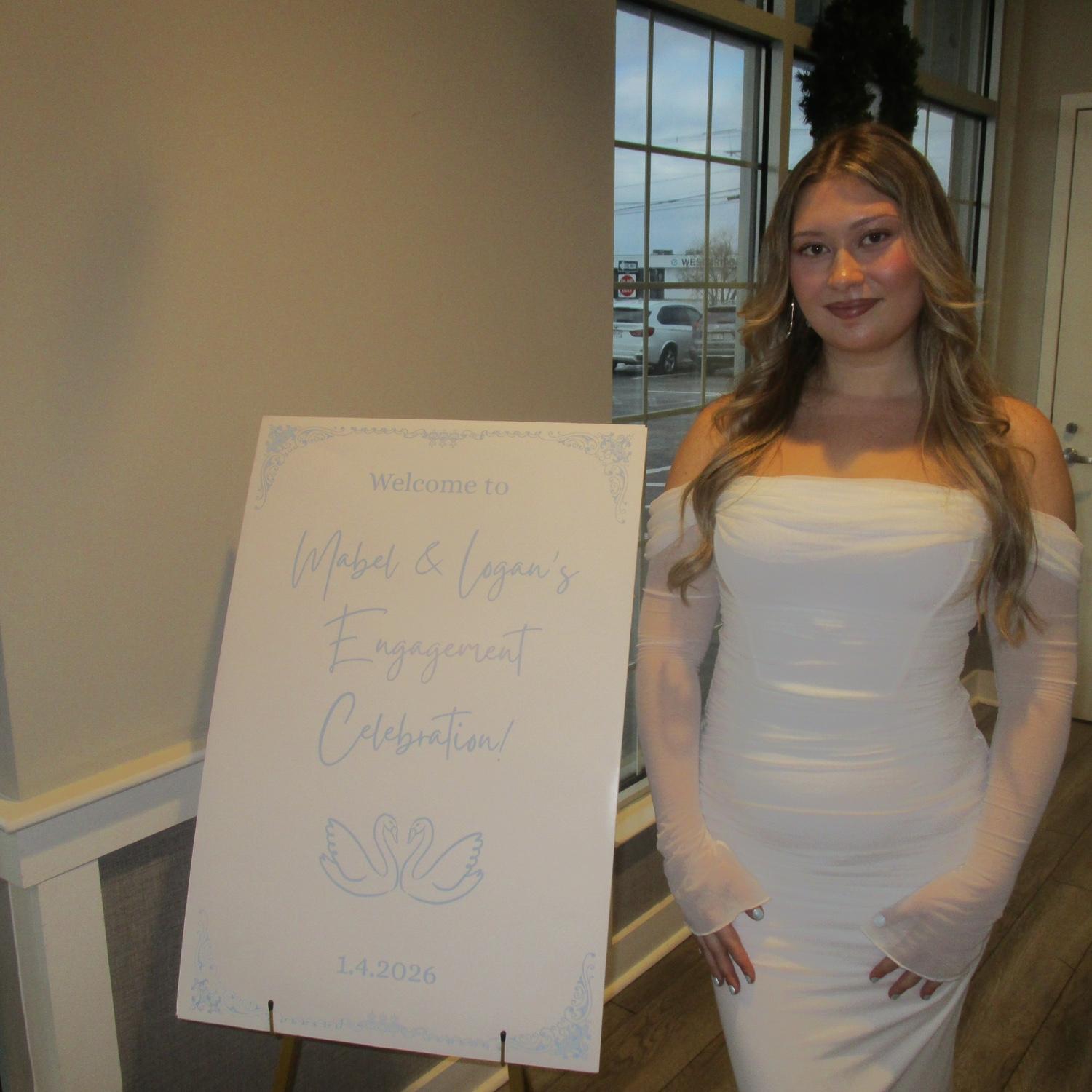Future bride in front of the welcome sign