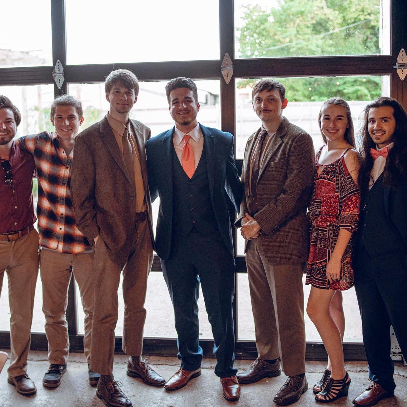 This photo was taken of us with our friend group at Hunter's (groomsman) wedding. - July 31, 2020