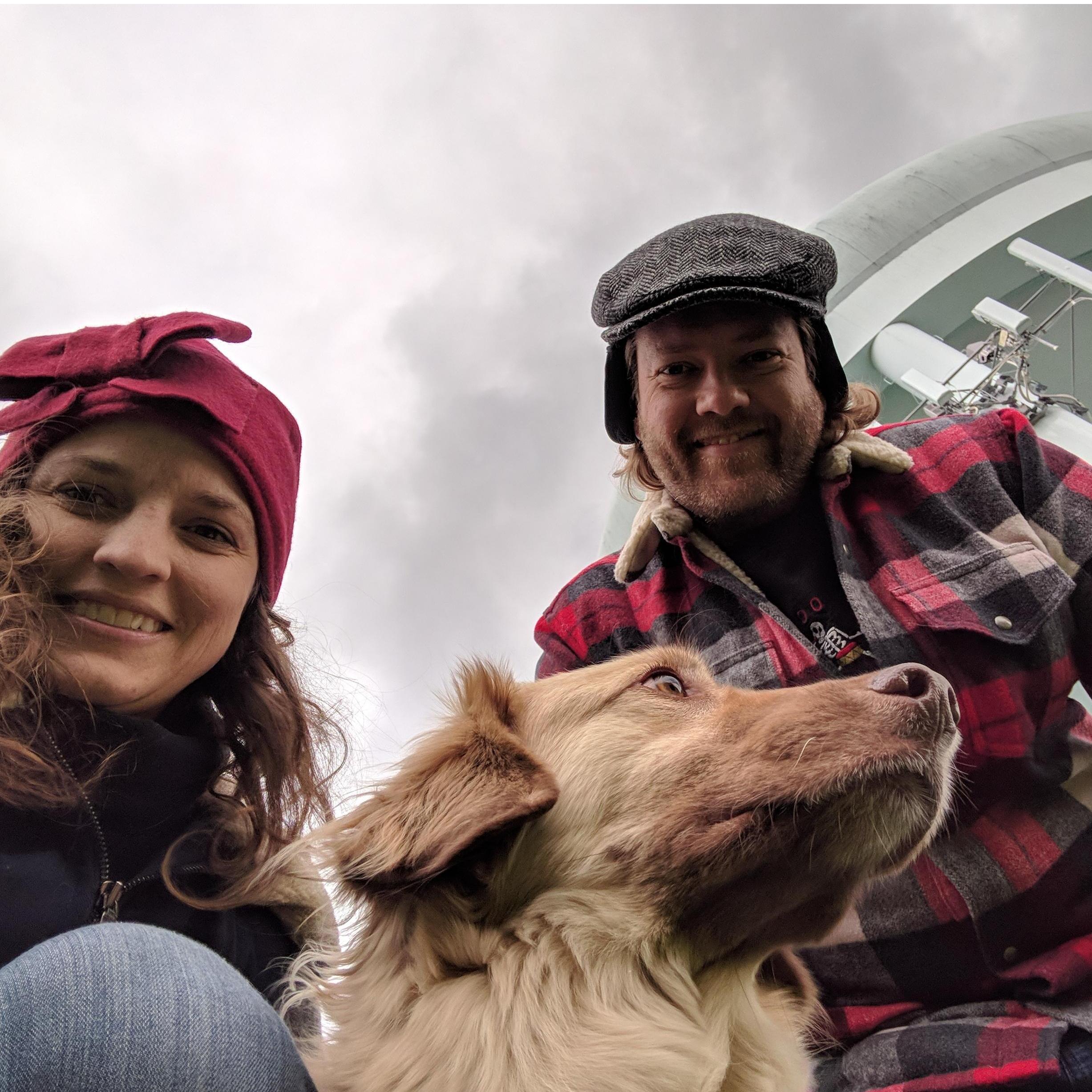 A happy couple and their philosopher dog.