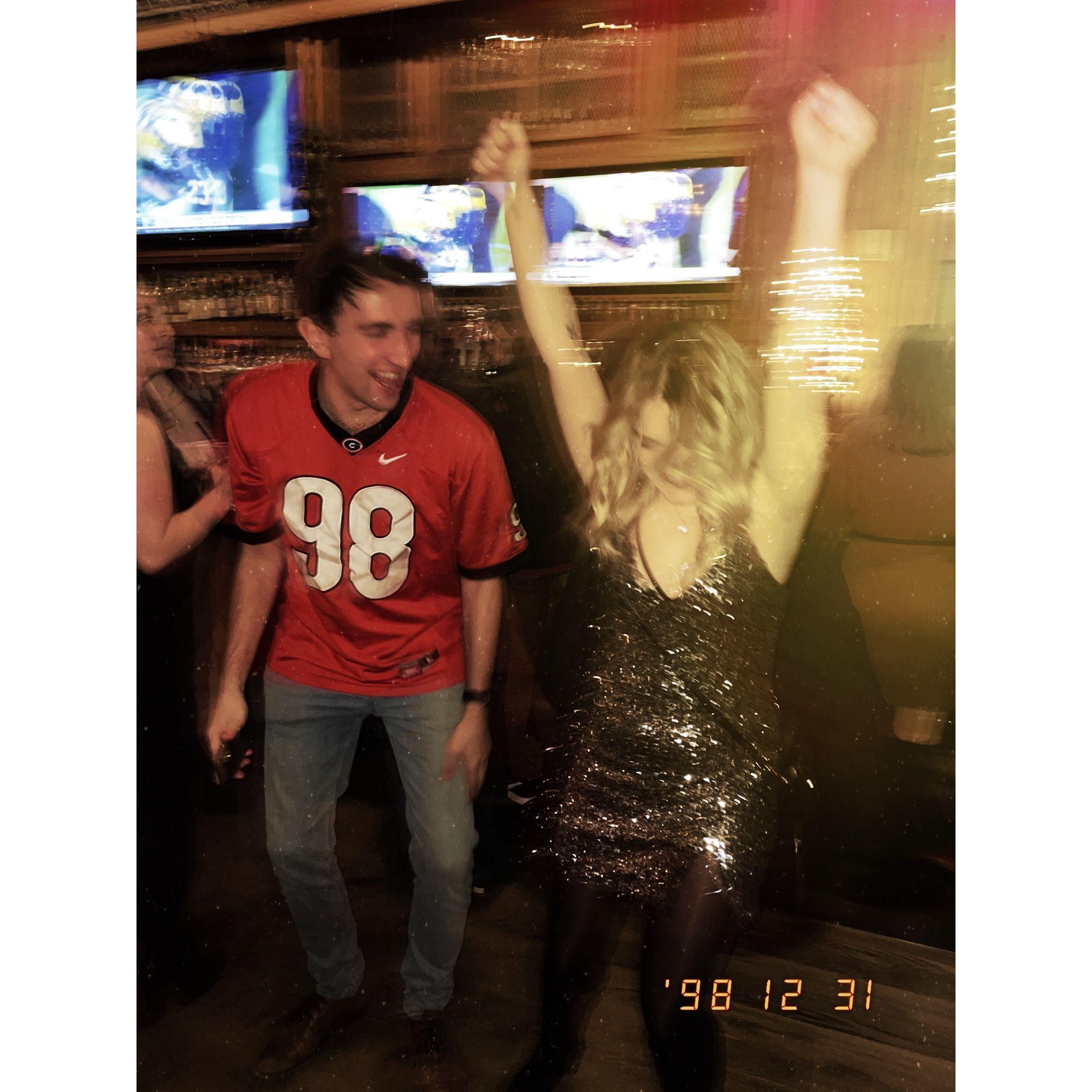 Us at American Whiskey, ringing in the new year of 2023 (and a sweet Georgia win!)