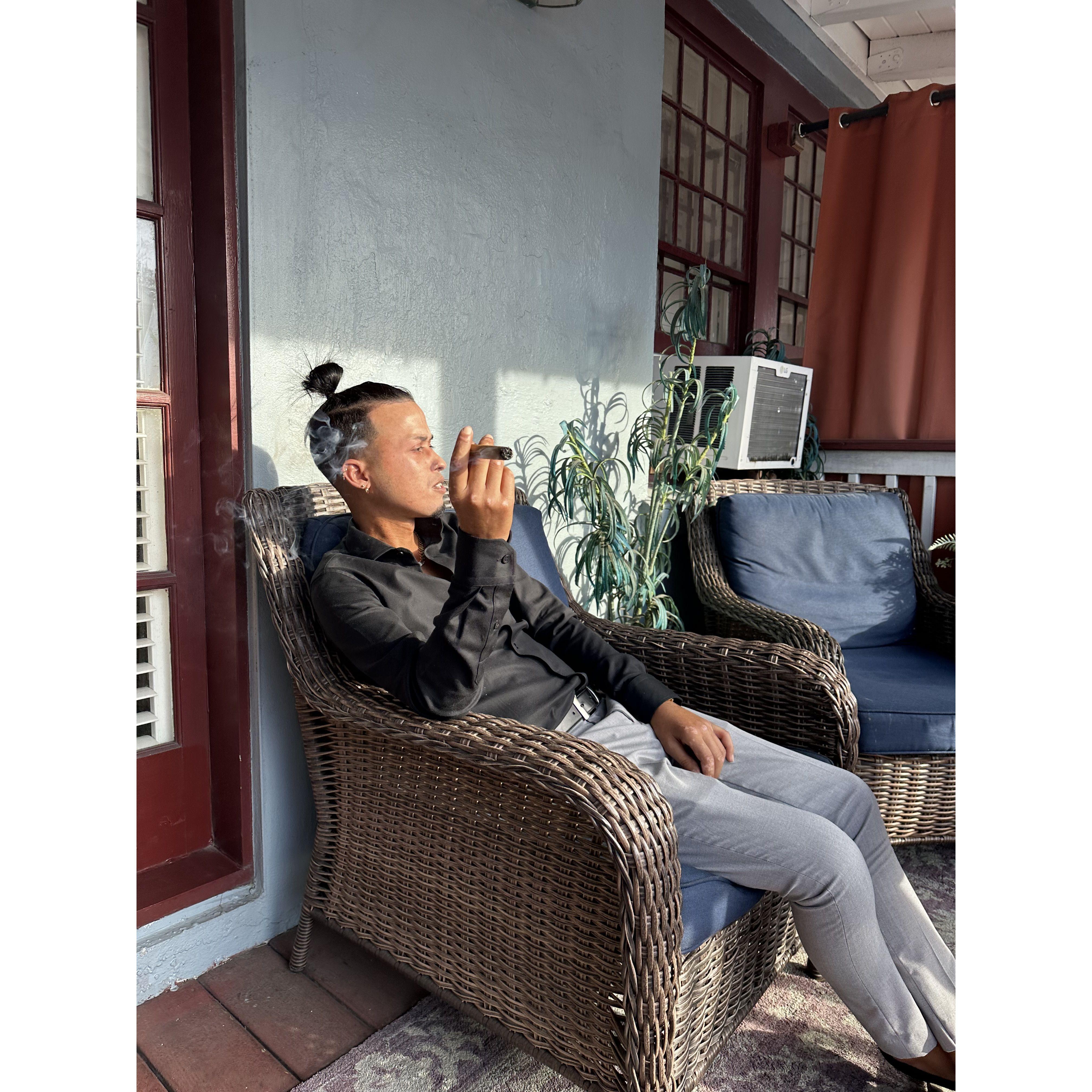 Eliel casually enjoying a cigar before his big surprise. We stayed at the Inn that housed the Tini Martini, Casa Blanca Inn!