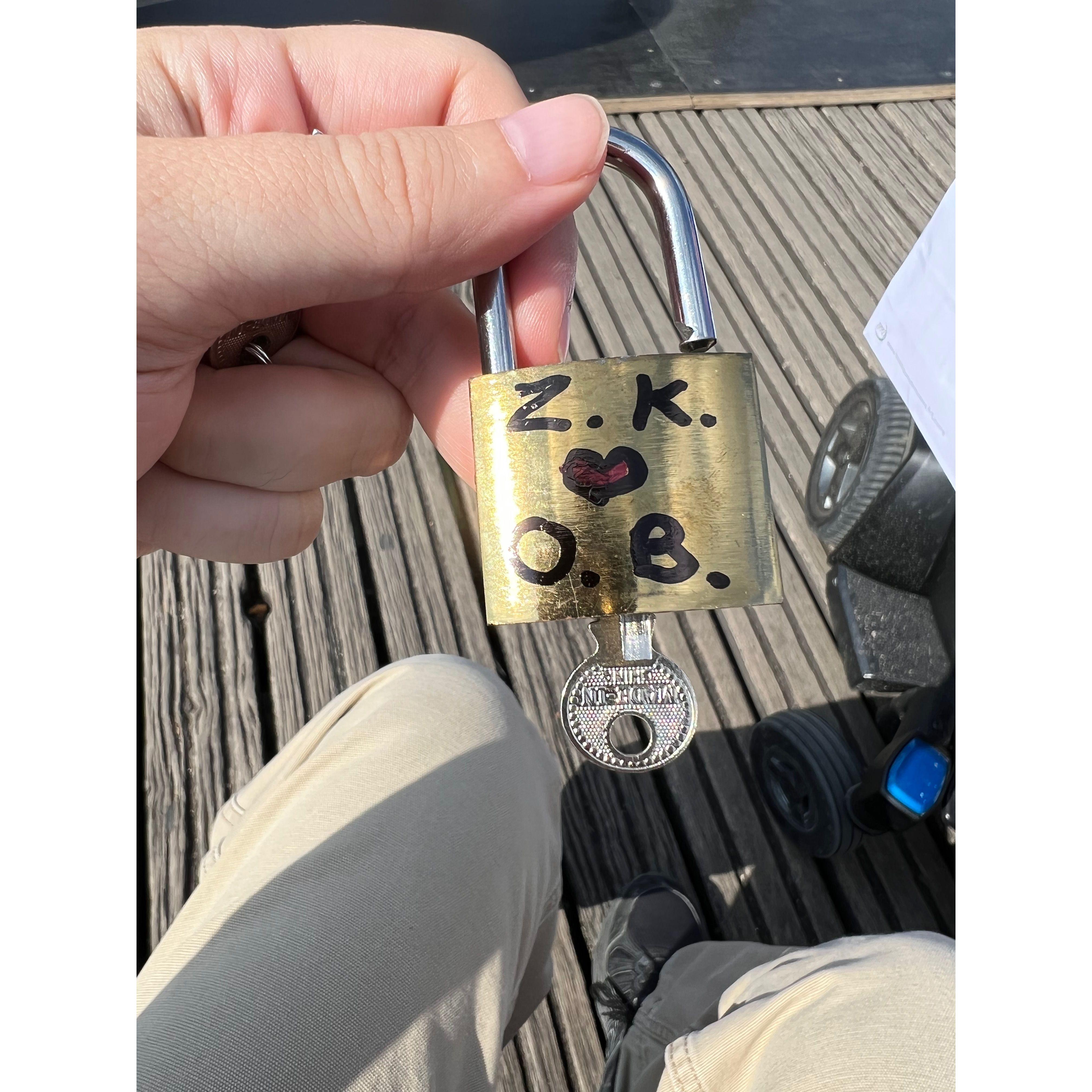 A lock with Zac and Olivia’s initials on it at the Love Lock bridge in Paris.