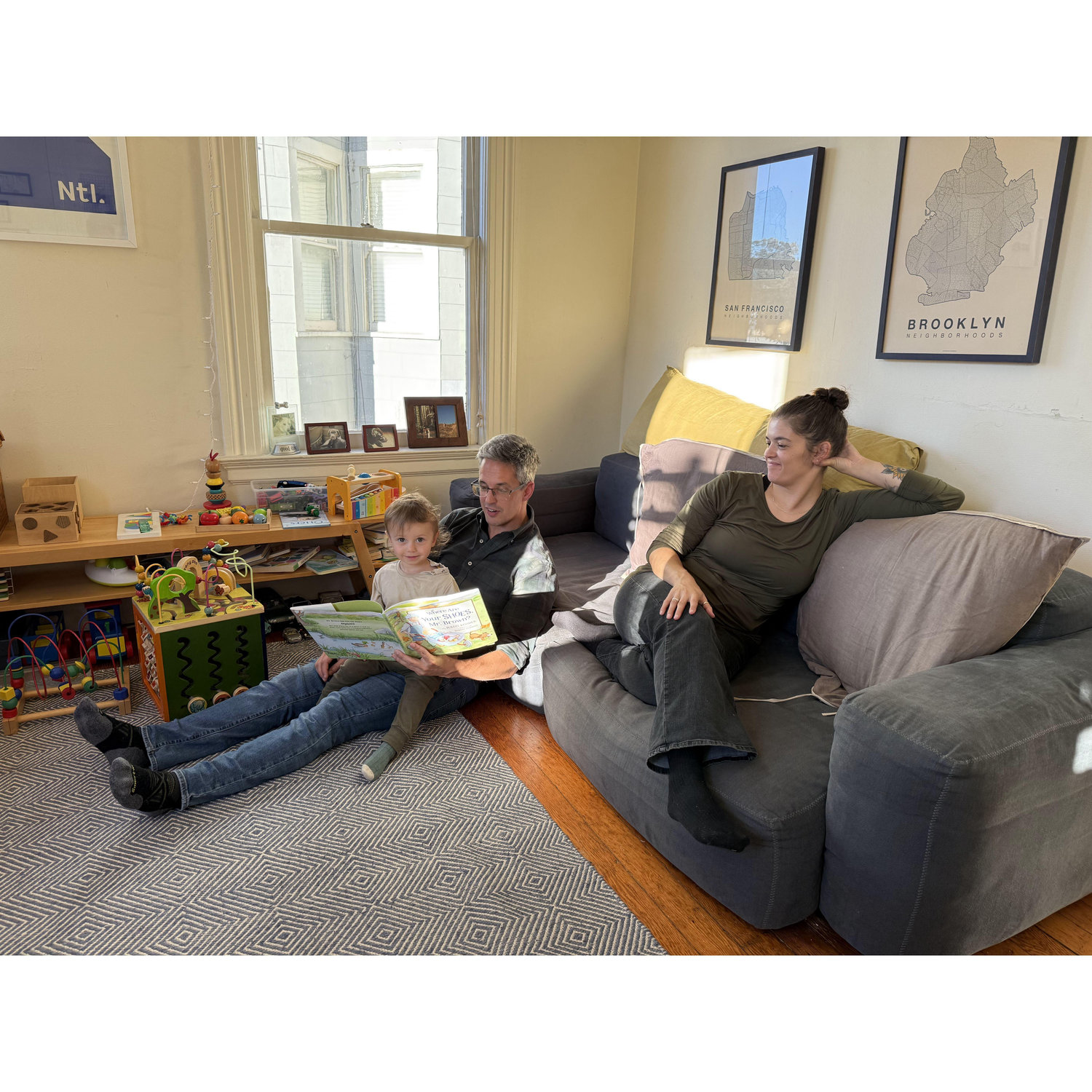 Thanksgiving at Fulton Street, reading to Daran (Brendan's nephew)
