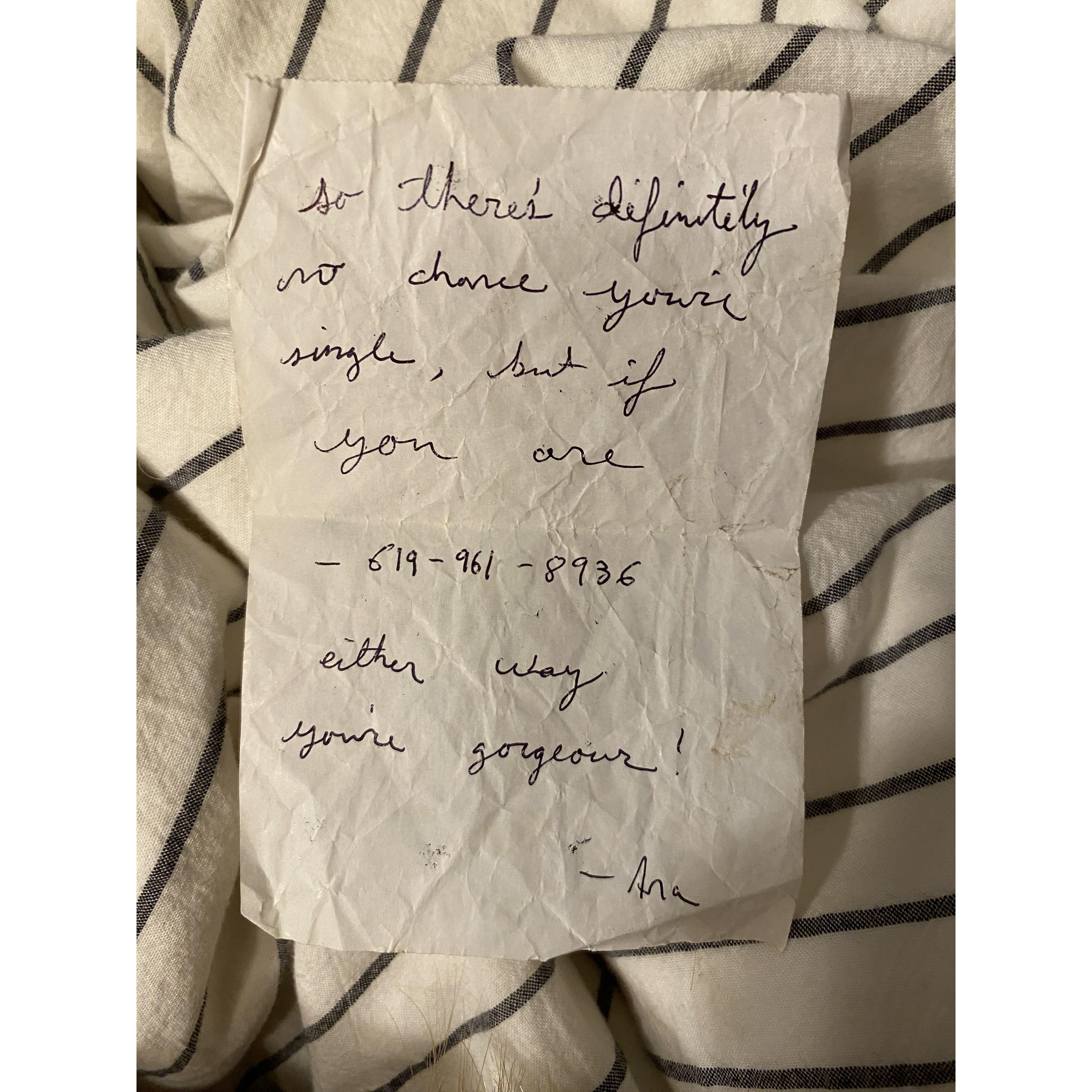 ....and at the end of the night she wrote her phone number on a piece of receipt paper from the cash register and passed it to Joe as he walked out the door, 

"This if for you." She said. 
"Thank you!" Said Joe.