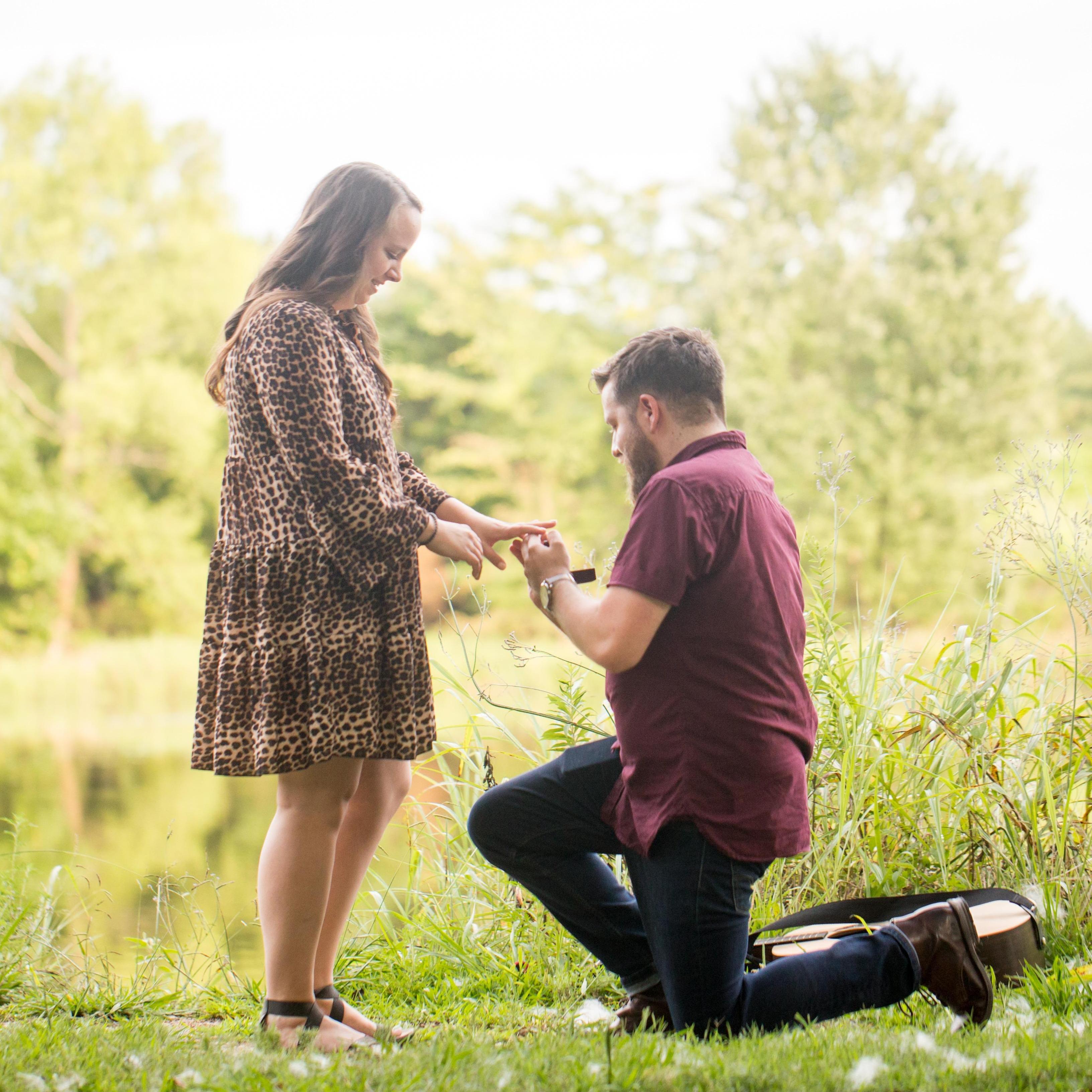 Lindsey laughing from joy while Sam proposes.