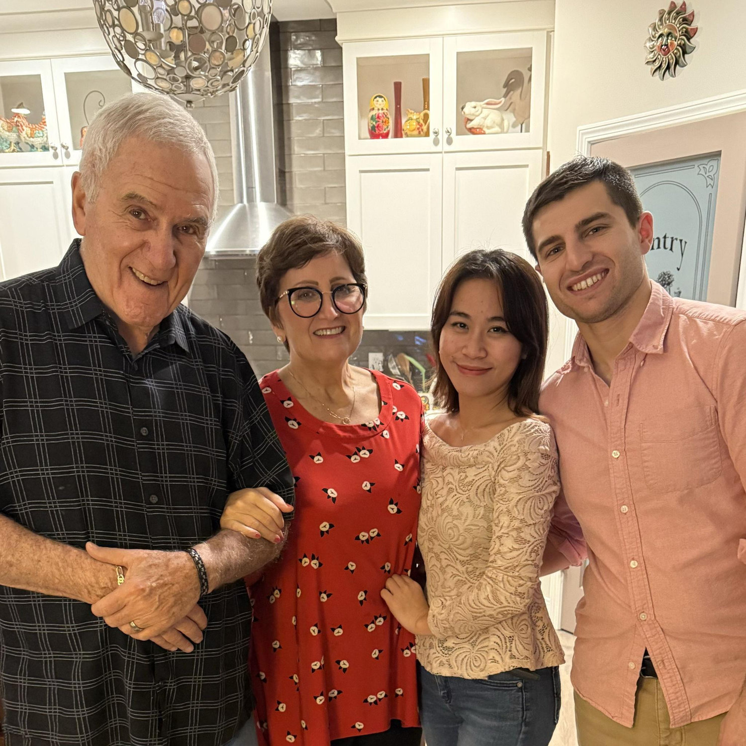 A Thanksgiving gathering with family but some loved ones just outside the frame.