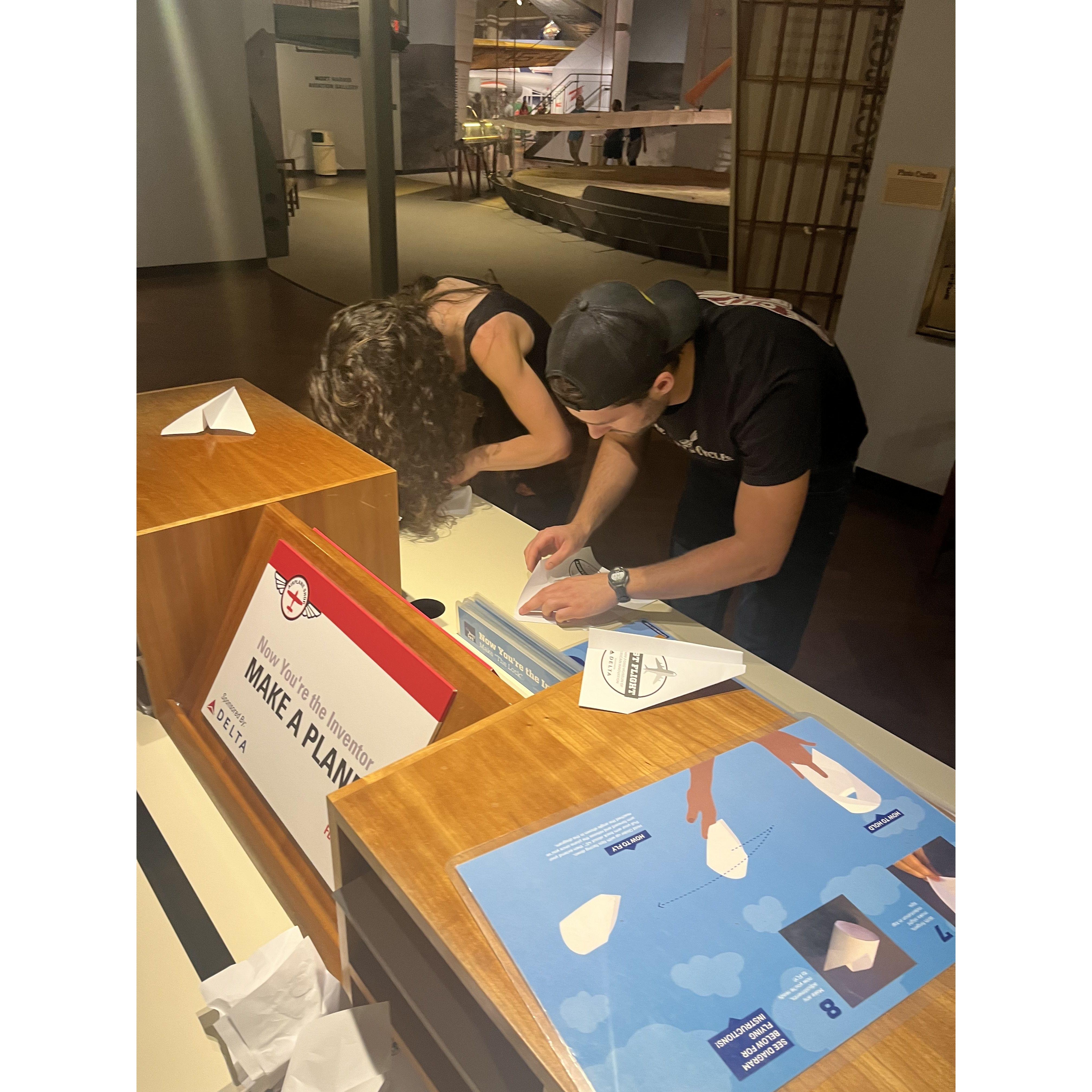 Studiously making paper airplanes for a museum competition; first trip to visit Nick's grandparents in Michigan.