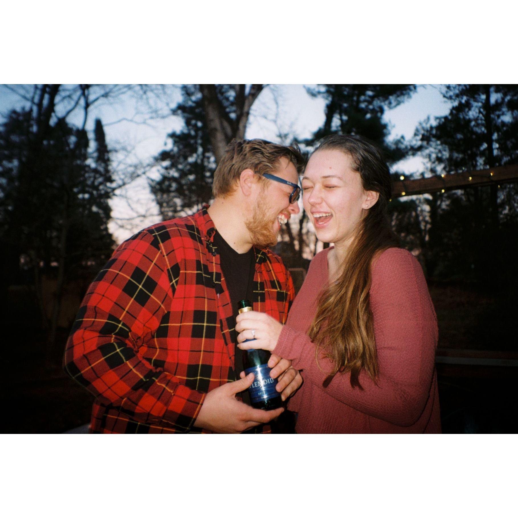 Popping some champagne after she said "yes"
