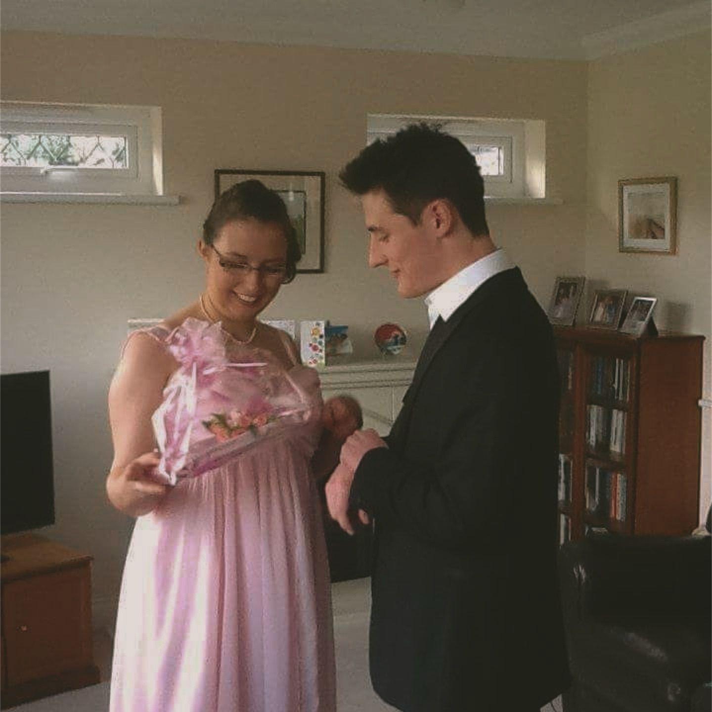 Nick giving Laurel her corsage on her prom!