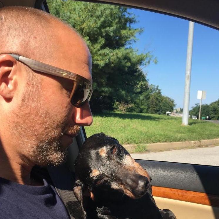 Bo loves going for car rides.