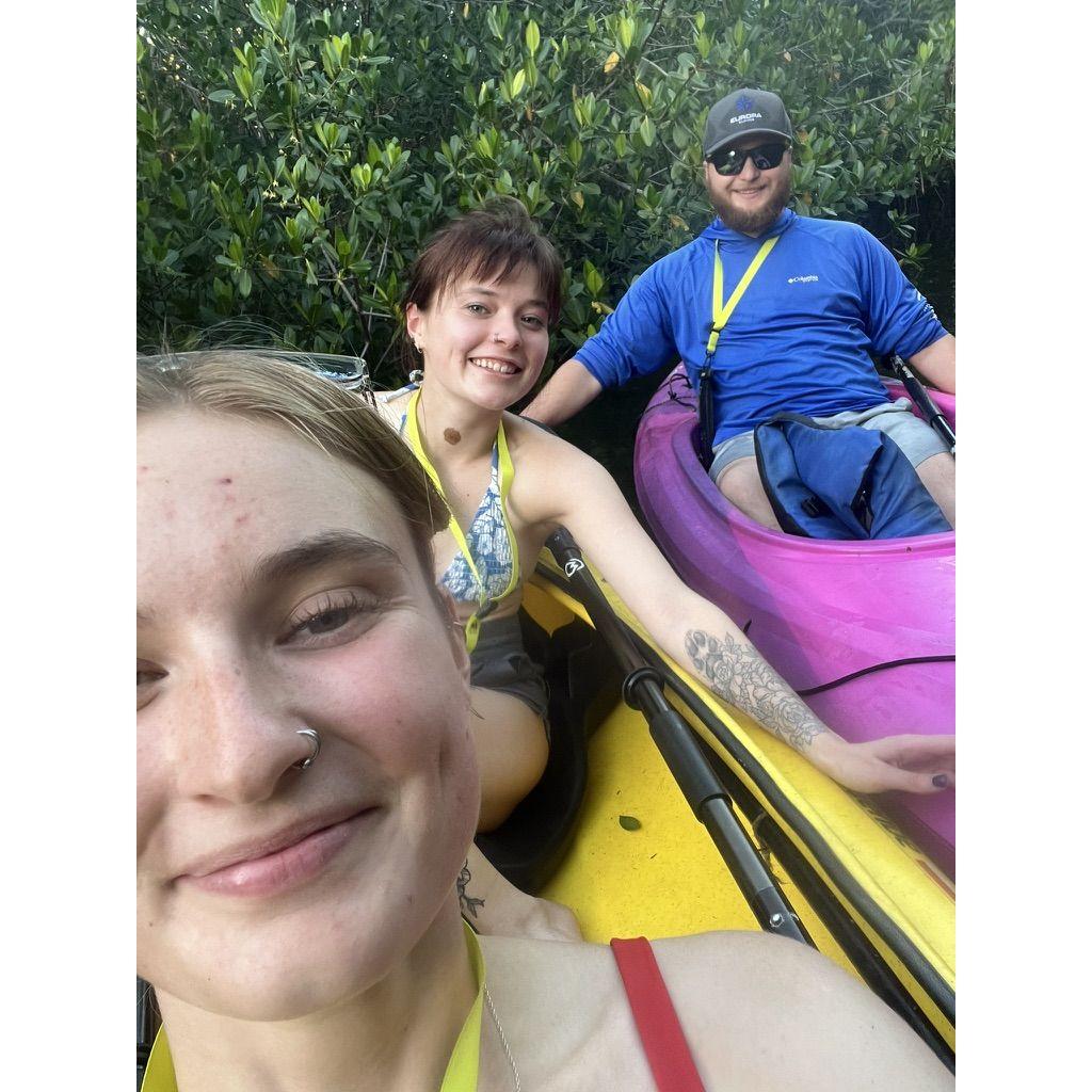 The bride and groom with the brides sister kayaking in the mangroves!
