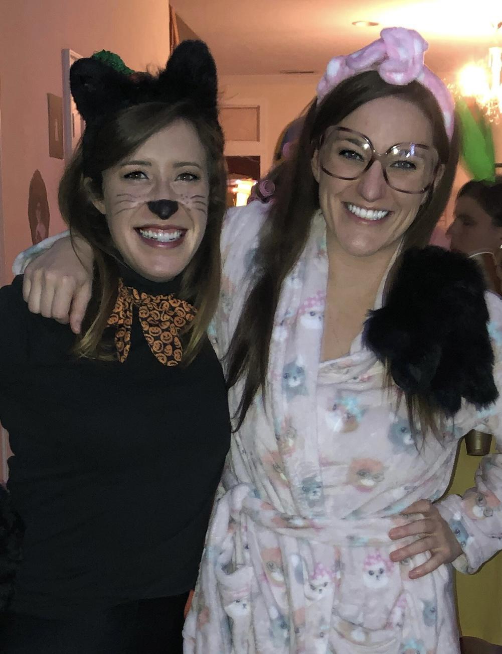 Successful Halloween for good ol' Gerty and her favorite cat that she dressed as a pumpkin