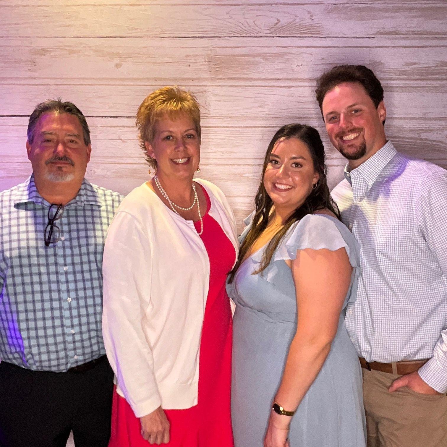 Jesse, Rebecca, and Becca’s parents at a wedding for Becca’s friend, Jacqui.
