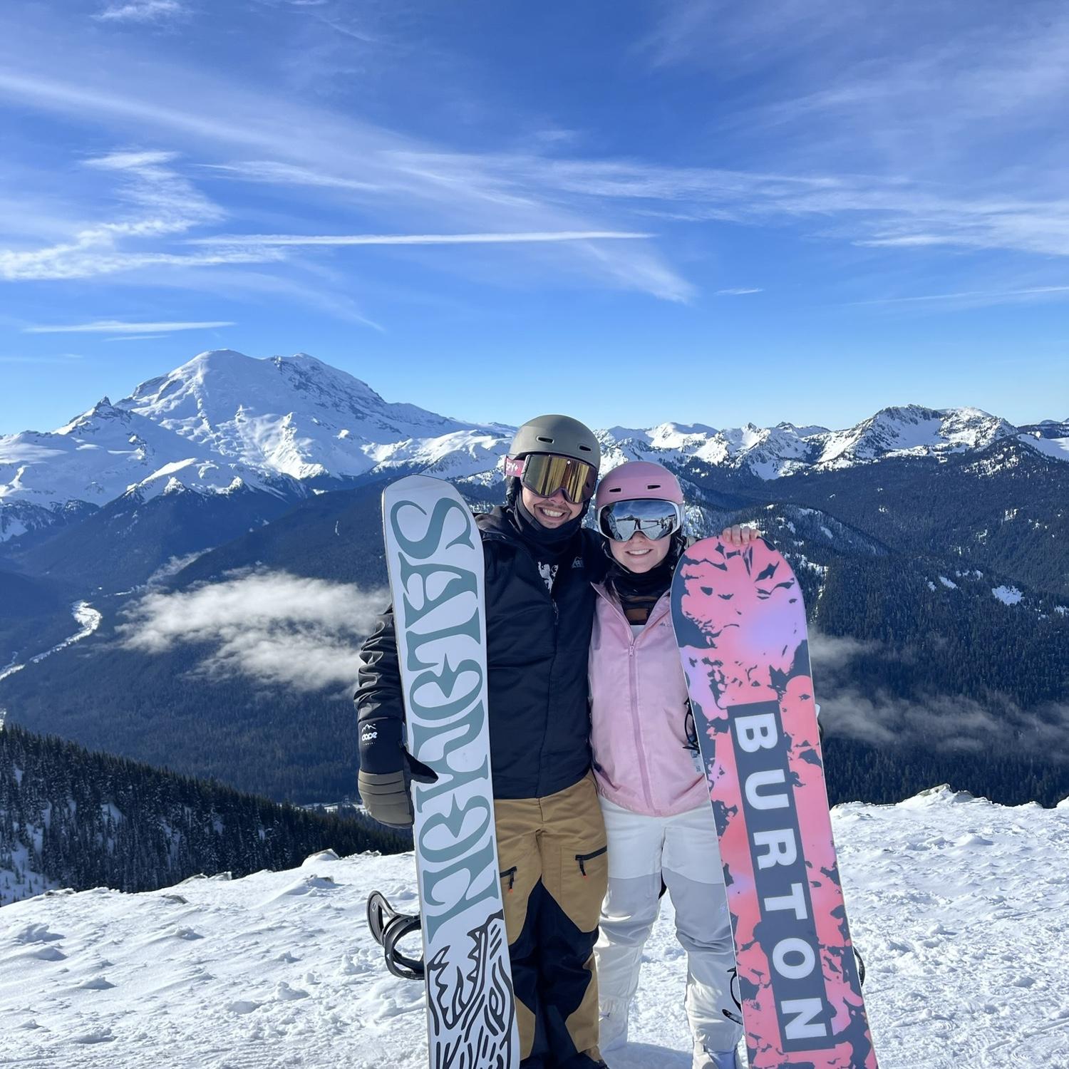 Snowboarding with views of Mount Rainier