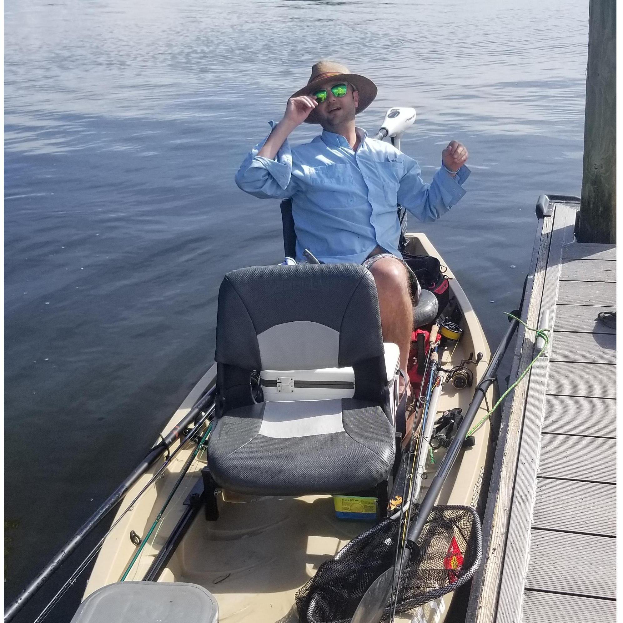 He lets me ride on his kayak.